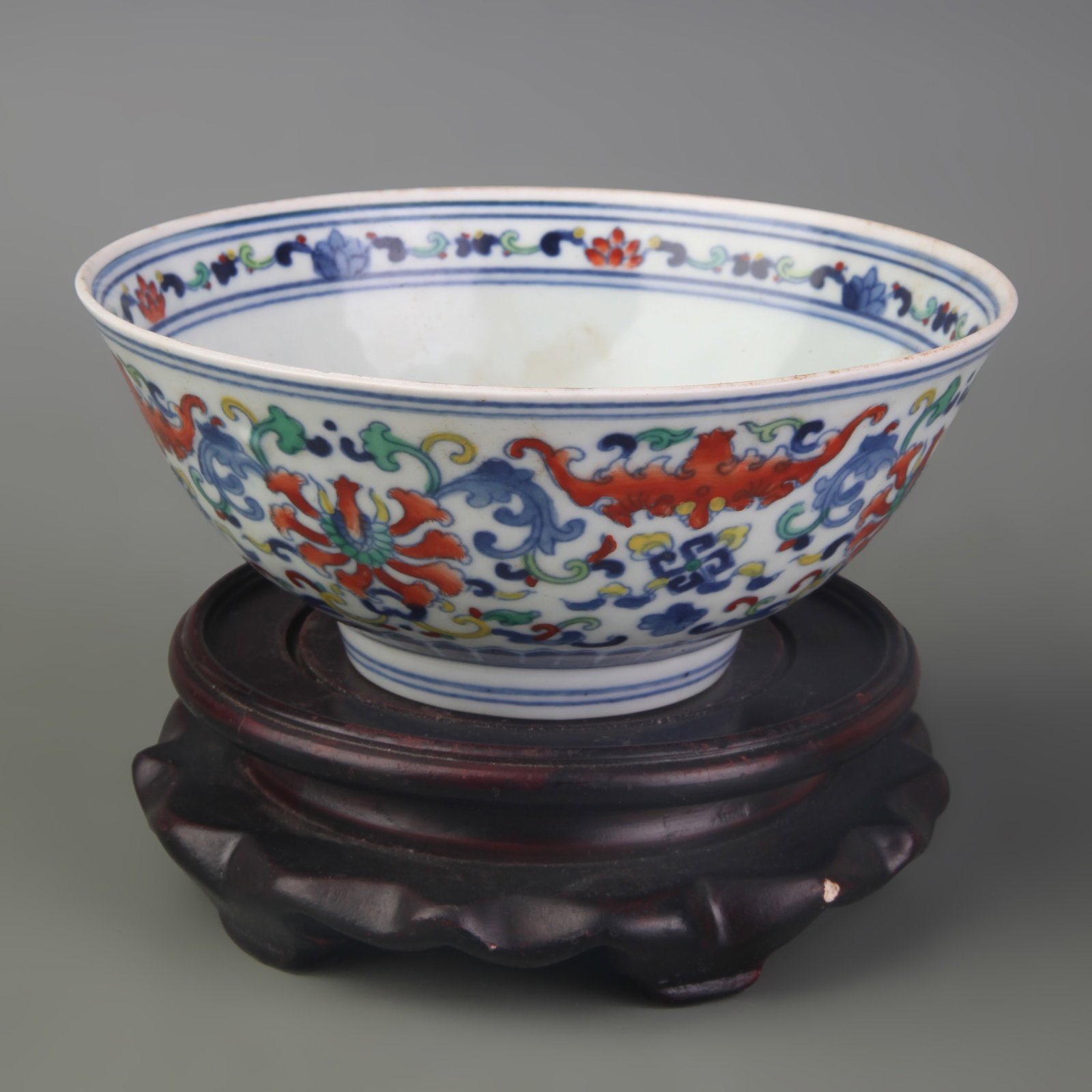 DOUCAI PORCELAIN BOWL WITH FLORAL PATTERNS PORCELAIN BOWL: Qing Dynasty Yong Zheng Period; Diameter: 5.5 inch; High: 2.5 inch; ;Wooden base for picture and display only.