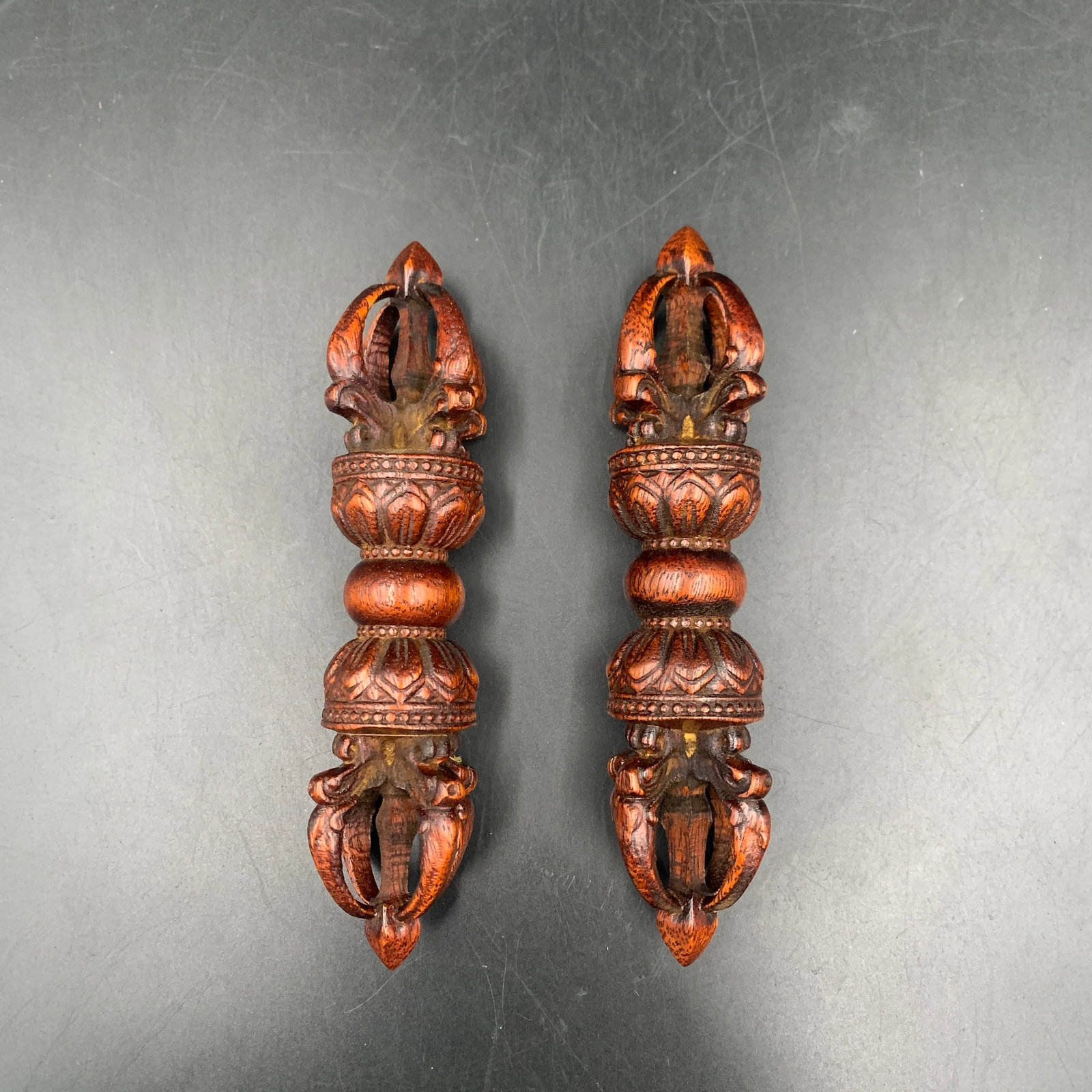 PAIR OF CARVED WOODEN VAJRAS: Modern; High: 6.5 inch; Diameter: 1.7 inch; ;Wooden base for picture and display only.