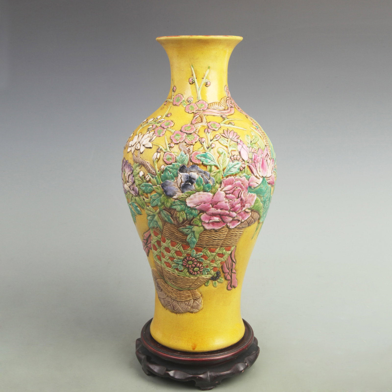 YELLOW GROUND FLOWER AND BIRD CARVING PORCELAIN VASE: Qing Dynasty Qian Long Period; High: 16.2 inch; Width: 8.5 inch; ;Wooden base for picture and display only.