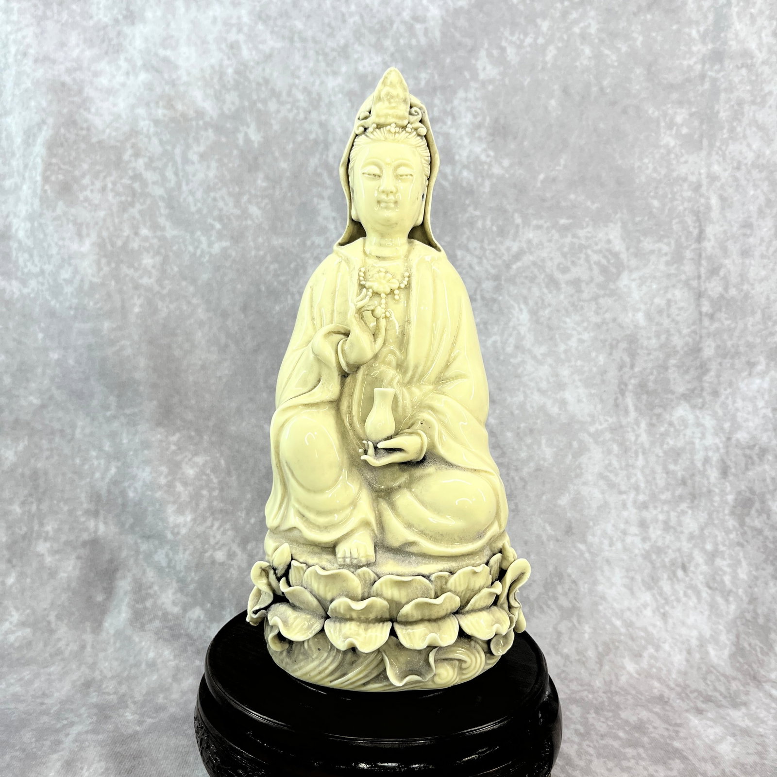 A FINE DEHUA-STYLE PORCELAIN GUANYIN: Republic Period; Long: 4.7 inch; Width: 4.2 inch; High: 10.3 inch; ;Wooden base for picture and display only.