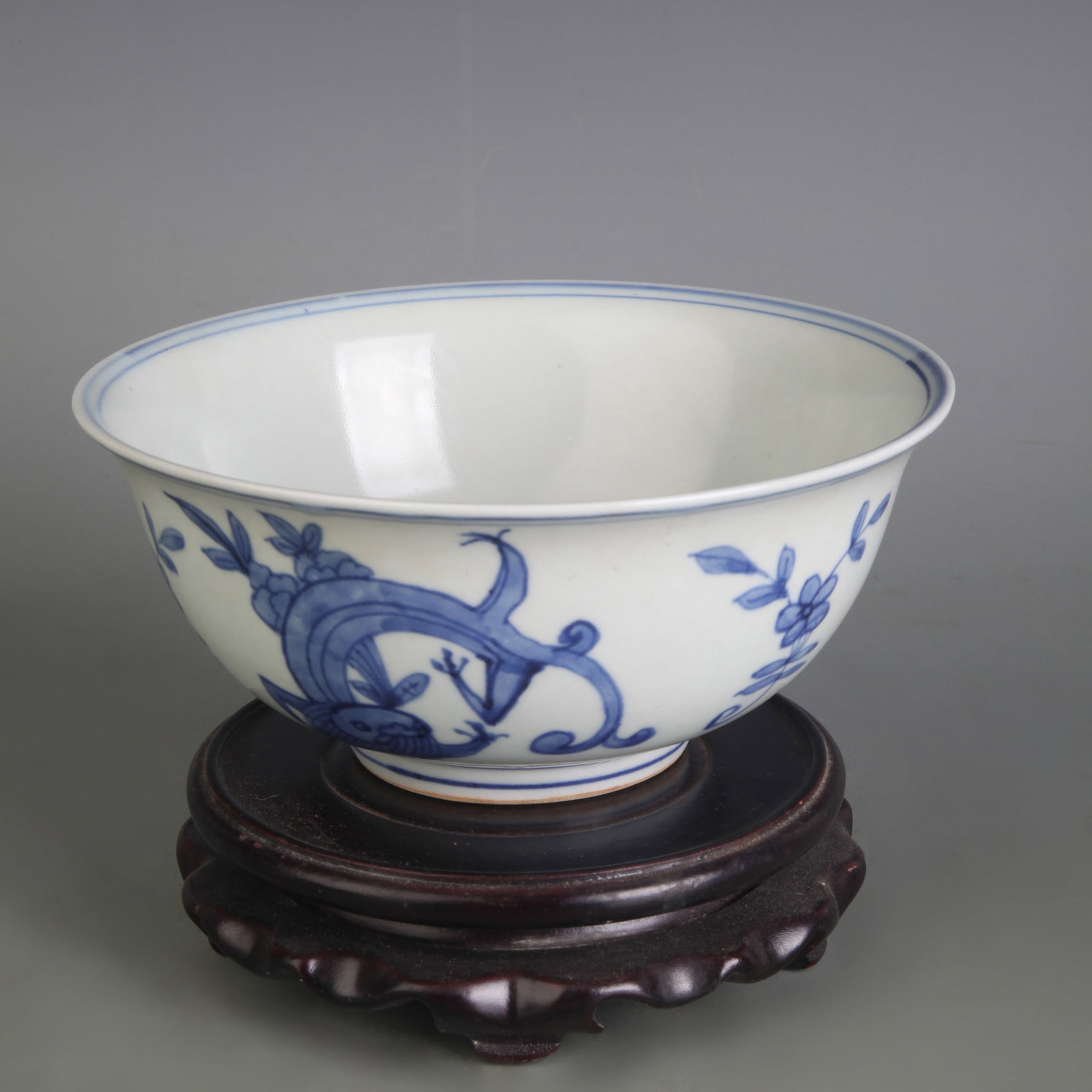BLUE AND WHITE BOWL WITH AUSPICIOUS BEAST DECORATION: Ming Dynasty Style Wan Li Period; Diameter: 6.4 inch; High: 2.8 inch;;Wooden base for picture and display only.