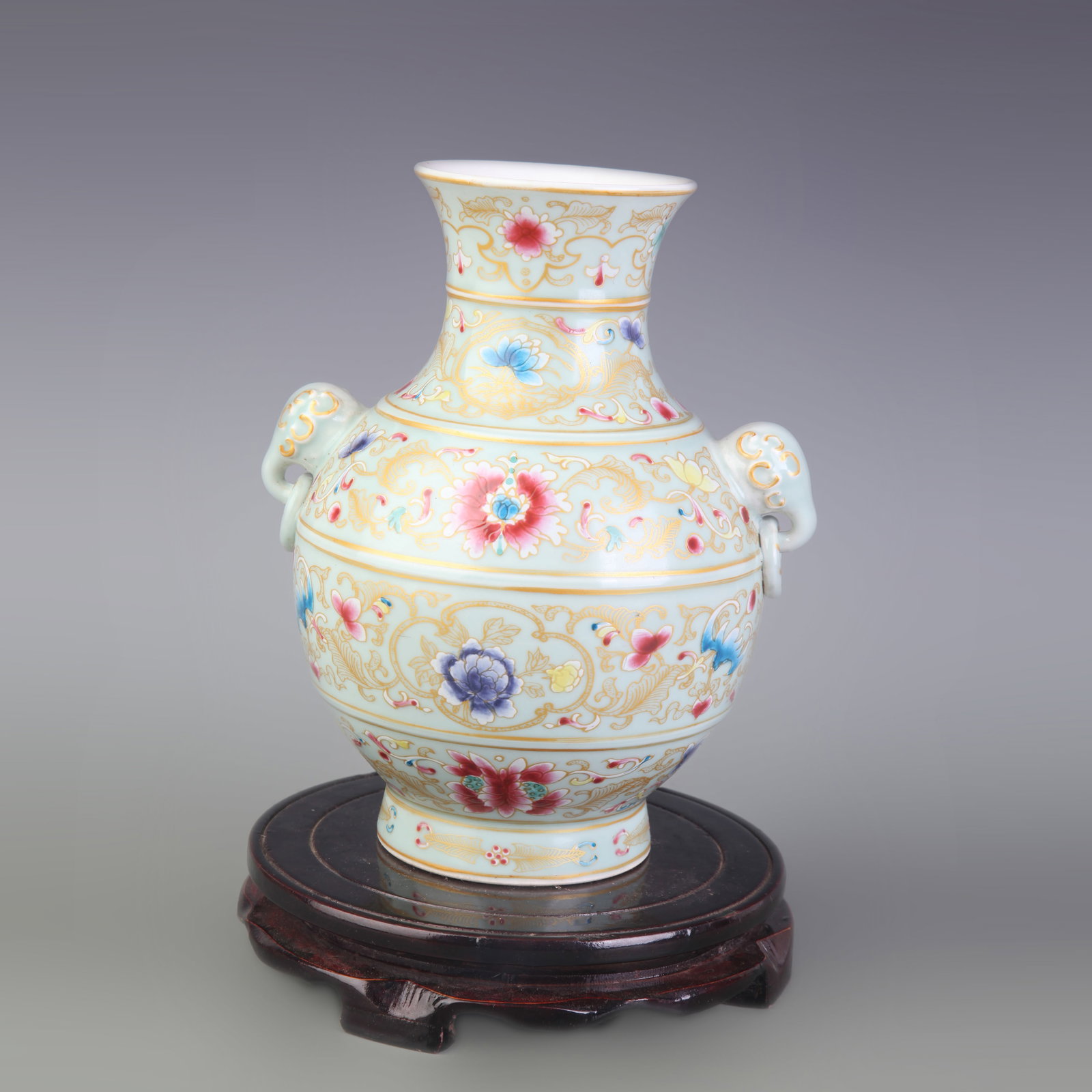 FAMILLE ROSE FLOWER PATTERN ELEPHANT-EAR PORCELAIN VASE: Qing Dynasty Qian Long Period; Diameter: 3.4 inch; High: 8.3 inch ;Wooden base for picture and display only.