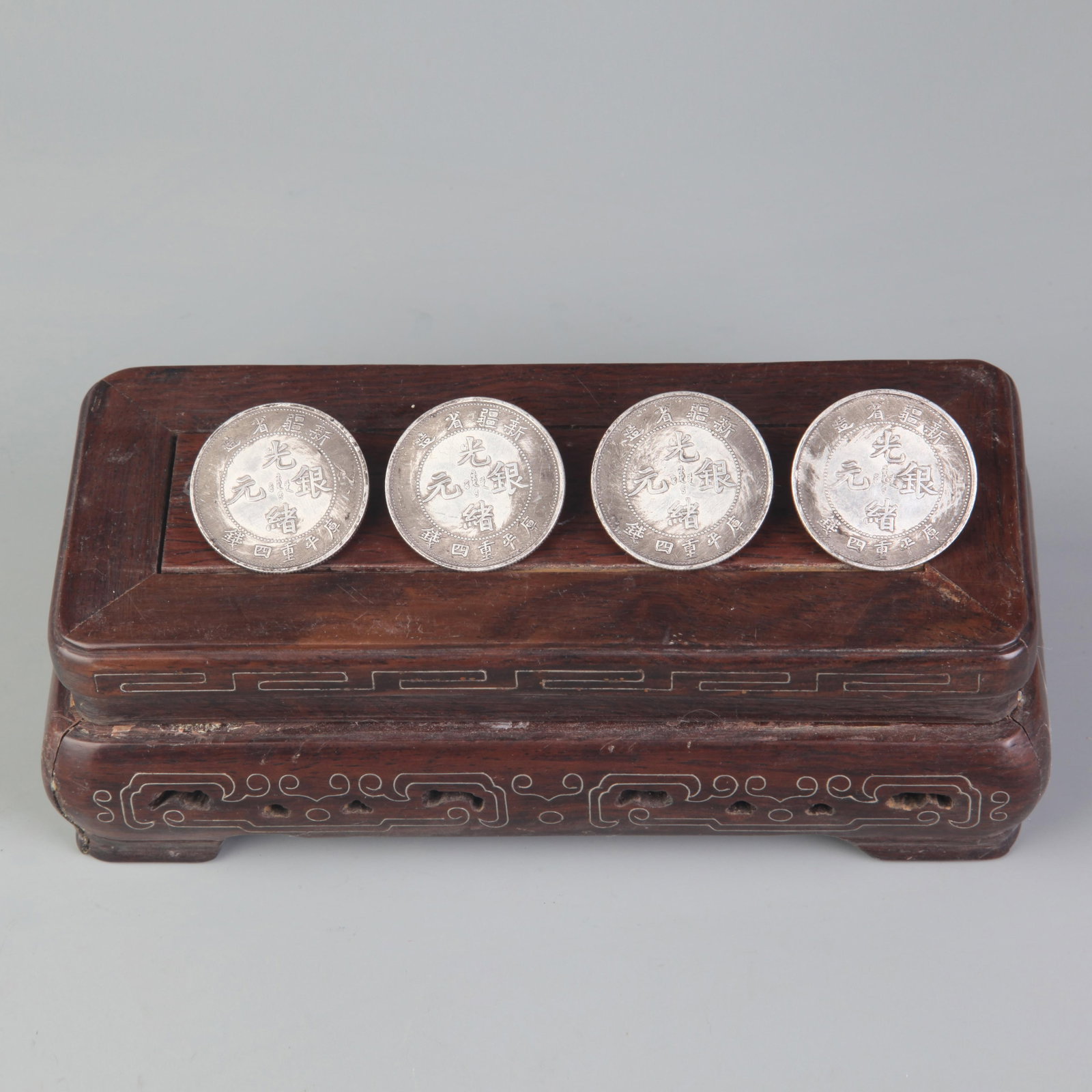 XINJIANG PROVINCIAL DRAGON PATTERN GUANGXU SILVER DOLLARS: Republic Period; Diameter: 1.3 inch; ;Wooden base for picture and display only.