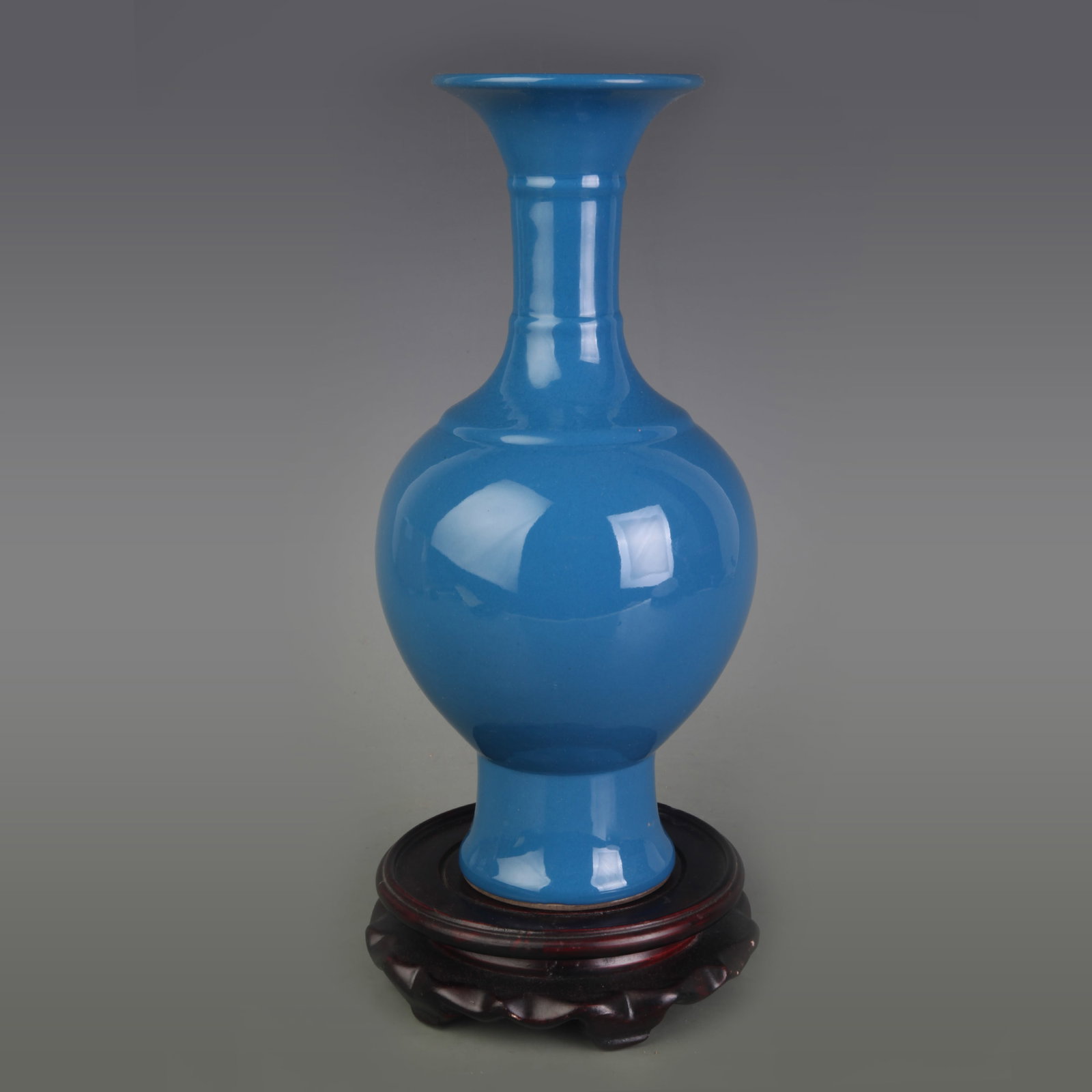 A PEACOCK-BLUE GLAZED PORCELAIN VASE: Qing Dynasty Qian Long Period; Diameter: 3.4 inch; High: 10.3 inch ;Wooden base for picture and display only.