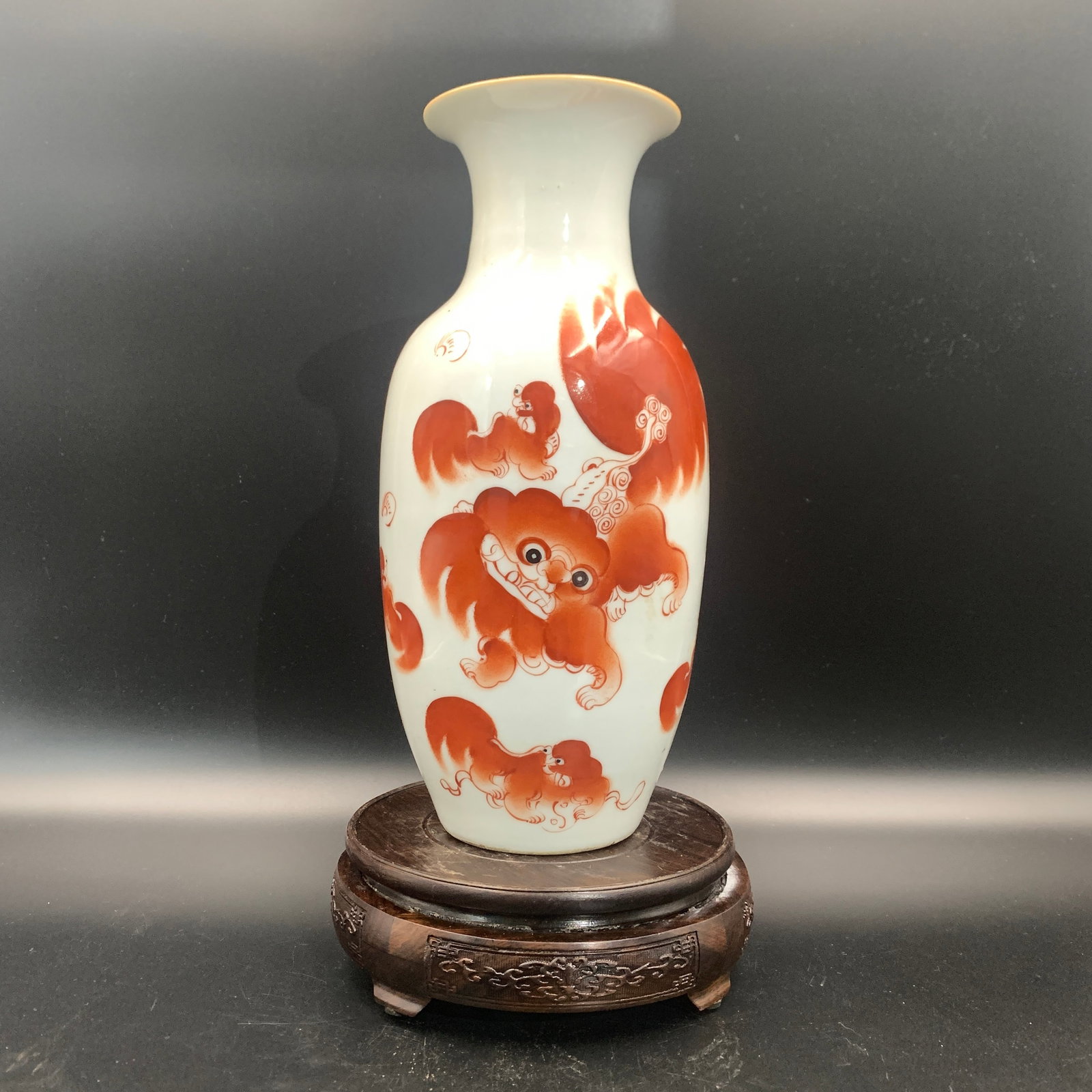 IRON-RED BUDDHIST LION AND RIBBON PATTERN LANTERN-FORM VASE: Qing Dynasty; High: 11 inch; Diameter: 5.2 inch; ;Wooden base for picture and display only.