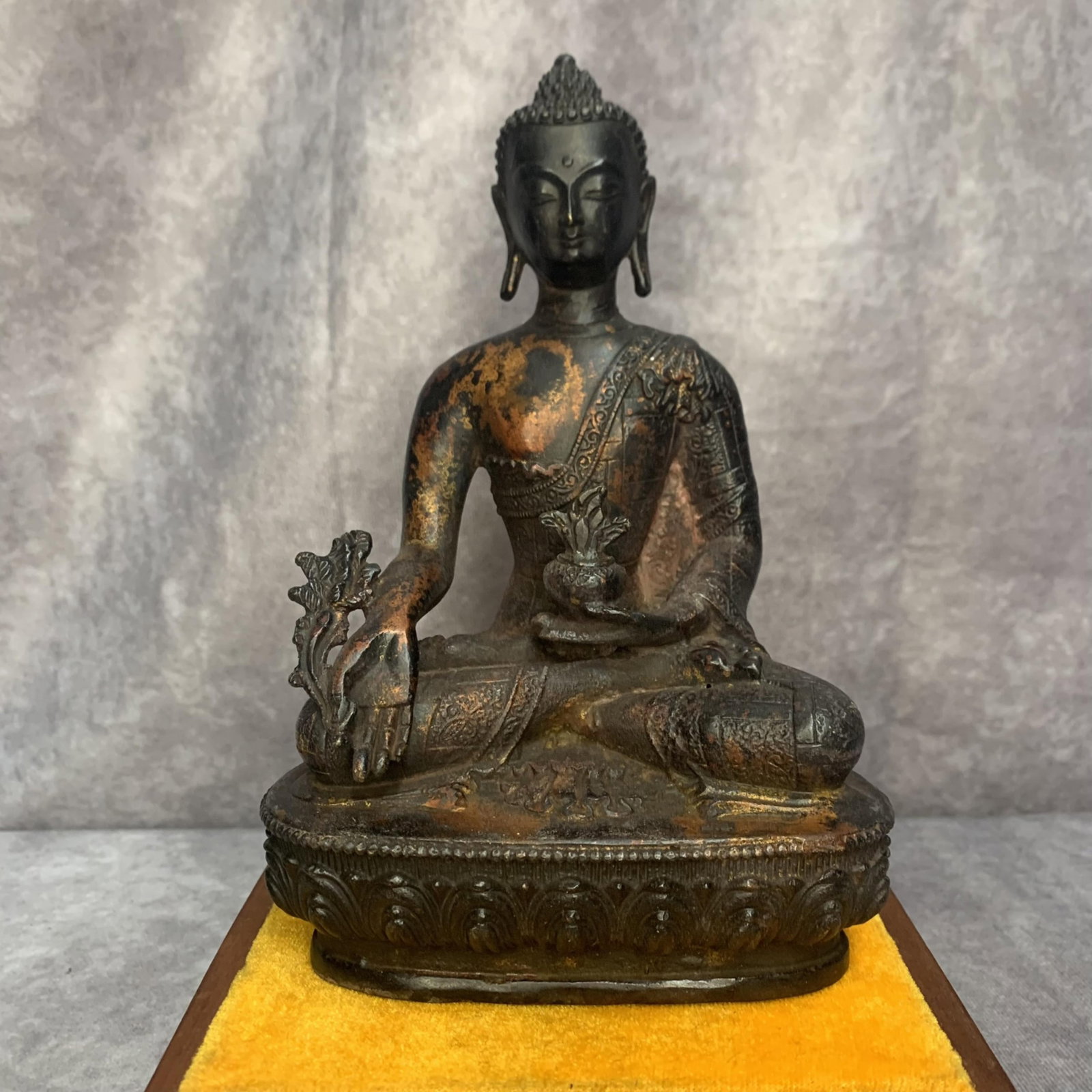 A FINELY CARVED BRONZE FIGURE OF MEDICINE BUDDHA (BHAISAJYAGURU): 20th Century; High: 7.9 inch; Width: 5.3 inch; Long: 3.4 inch ;Wooden base for picture and display only.