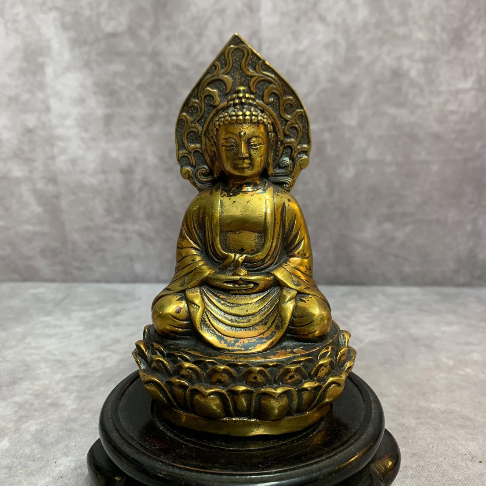 A SMALL BRONZE TATHAGATA STATUE: 20th Century; High: 5.3 inch; Width: 2.2 inch; Long: 3.1 inch; ;Wooden base for picture and display only.