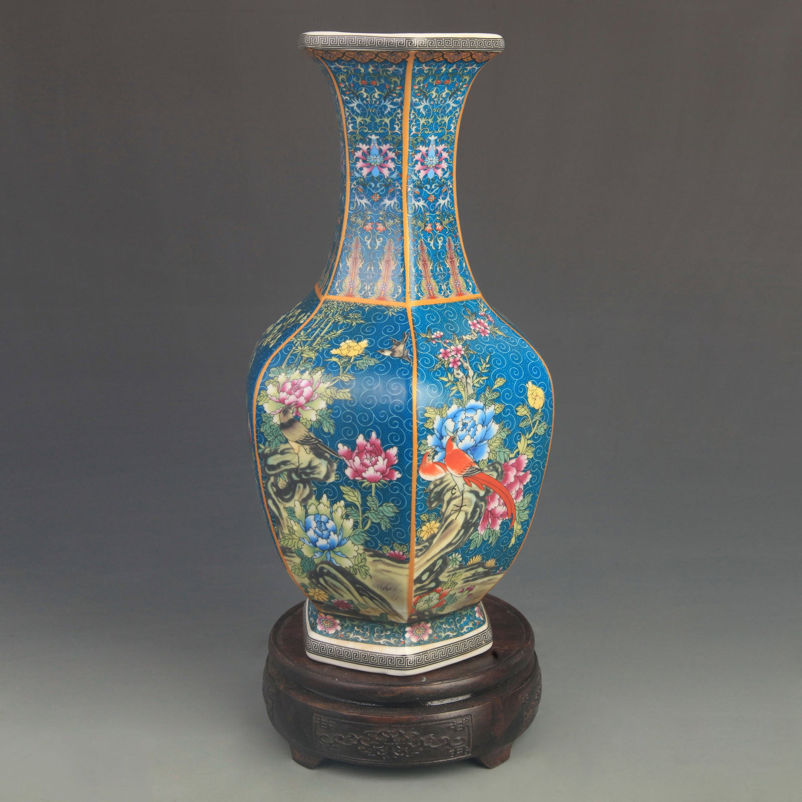 FAMILLE ROSE BLUE GLAZED FLOWER PATTERN SIX SIDE VASE: Qing Dynasty Qian Long Period; High: 12.0 inch; Diameter: 6.00 inch; ;Wooden base for picture and display only.
