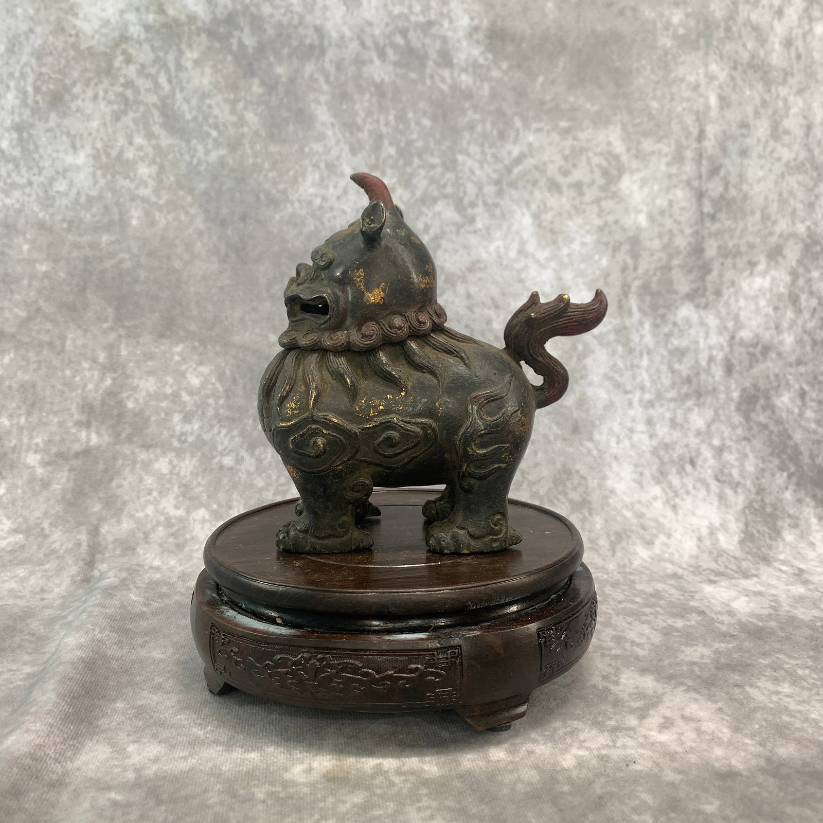 GILT-BRONZE XIEZHI MYTHICAL BEAST INCENSE BURNER: Qing Dynasty; Long: 5.8 inch; Width: 3.1 inch; High: 6.1 inch; ;Wooden base for picture and display only.