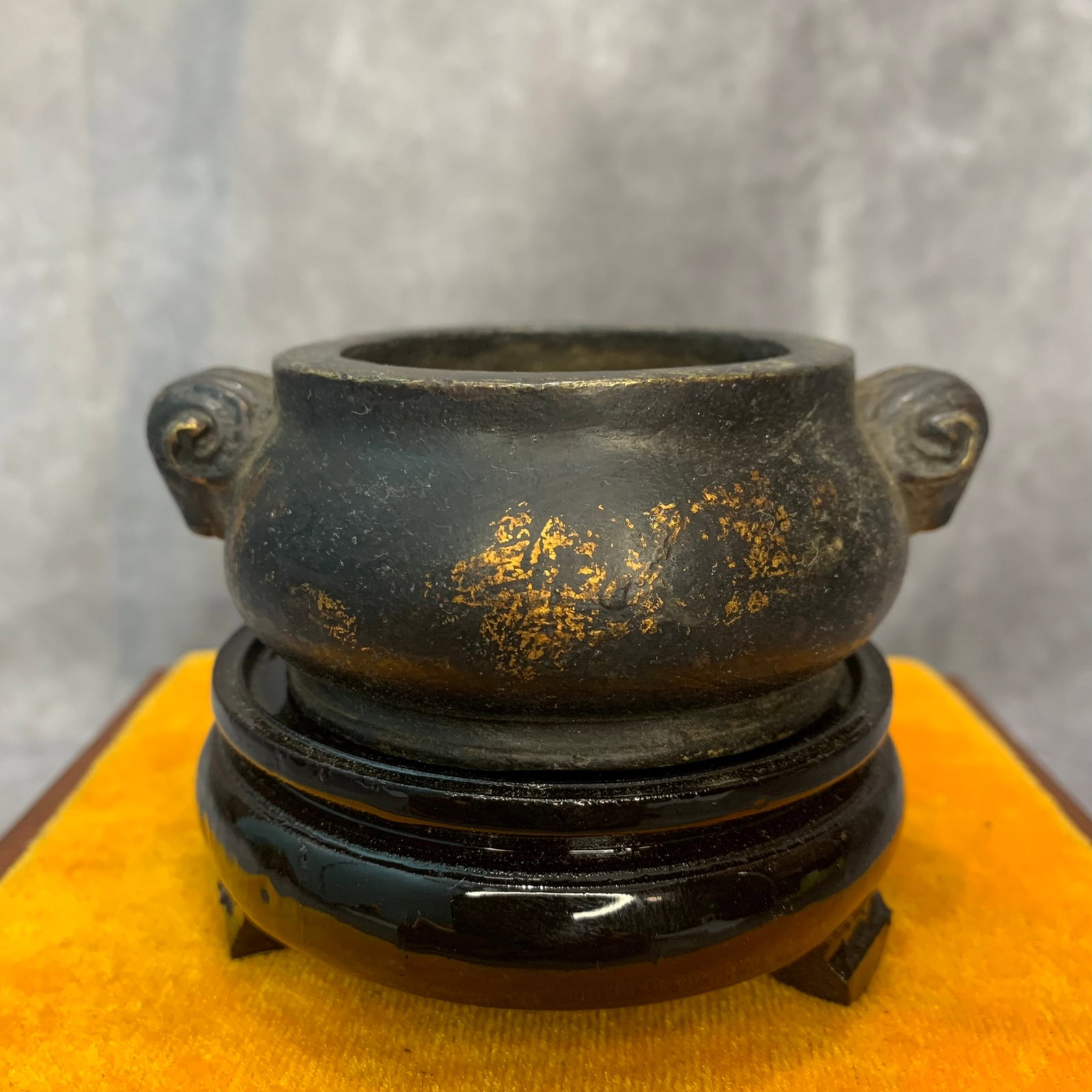 GILT-BRONZE RAM-HEAD HANDLE BOMIAN CENSER: Qing Dynasty; High: 1.5 inch; Diameter: 3.0 inch ;Wooden base for picture and display only.