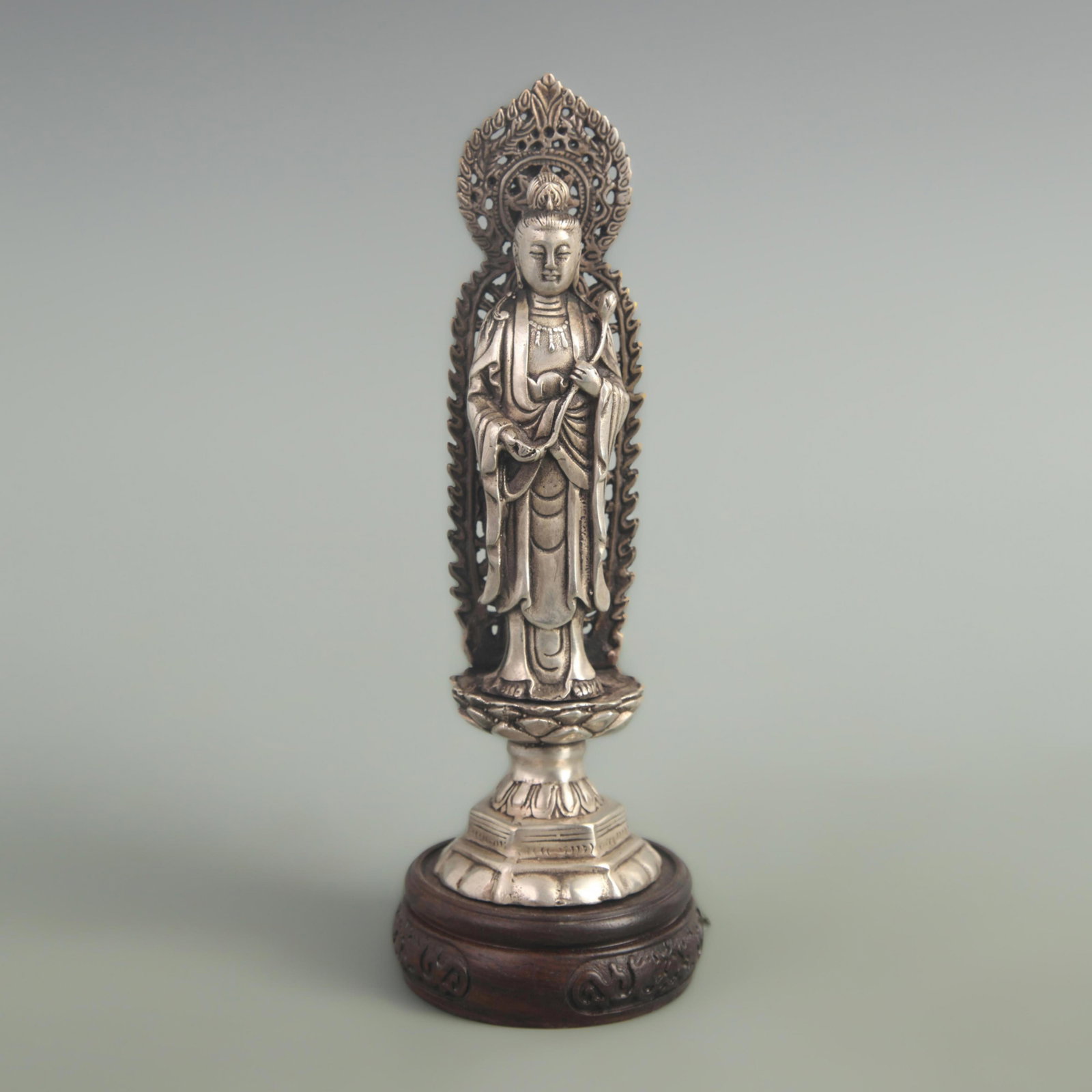 A FINE WHITE BRONZE GUAN YIN STATUE: 20th Century; High: 7.80 inch Diameter: 2.10 inch ;Wooden base for picture and display only.