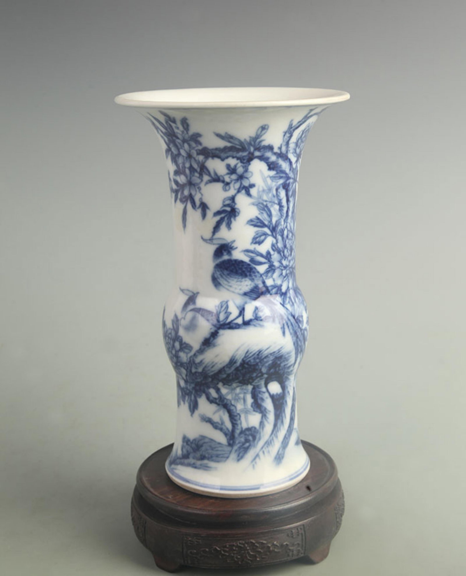 BLUE AND WHITE PORCELAIN GOBLET WITH FLORAL AND BIRD MOTIFS: Qing Dynasty Kang Xi Period; High: 9.80 inch; Diameter: 5.80 inch; ;Wooden base for picture and display only.