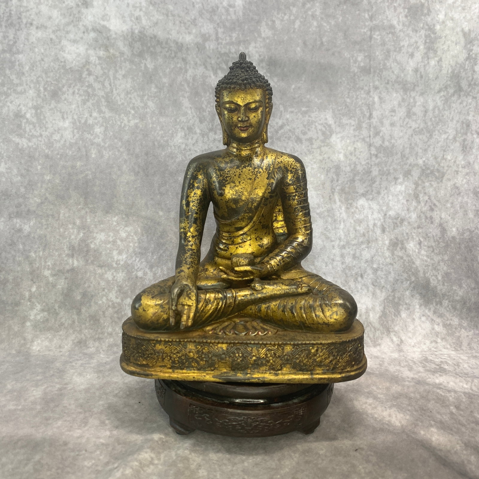 GILT-BRONZE SEATED SHAKYAMUNI BUDDHA STATUE: Ming Dynasty Style; Long: 8.5 inch; Width: 5.5 inch; High: 10.6 inch; ;Wooden base for picture and display only.