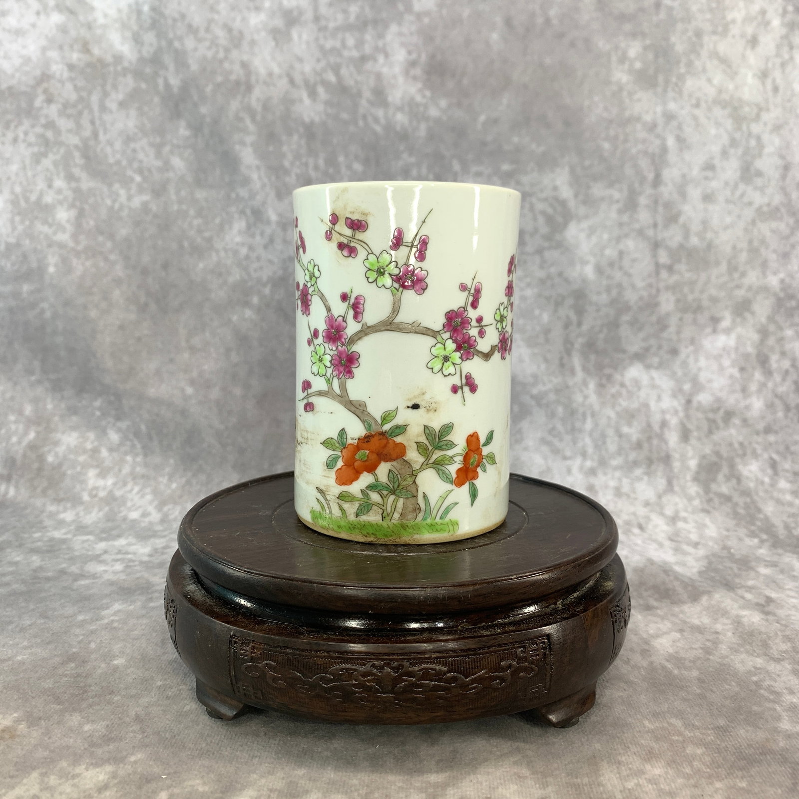 FAMILLE ROSE PRUNUS AND PEONY BLOSSOM BRUSH POT: Qing Dynasty; High: 4.5 inch; Diameter: 3.1 inch; ;Wooden base for picture and display only.