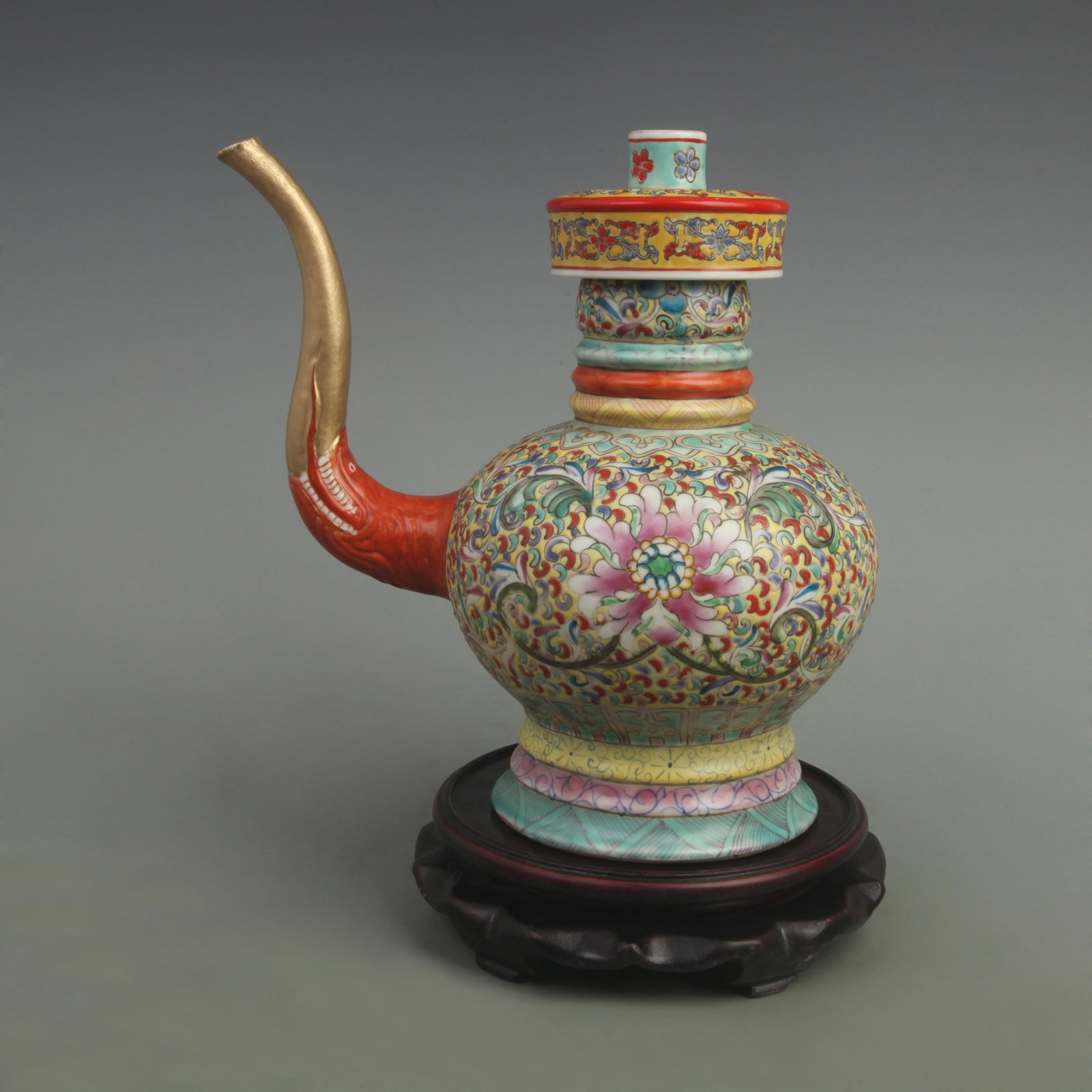 RARE FAMILLE ROSE FLOWER PATTERN PORCELAIN EWER: Qing Dynasty Qianlong Period; High: 10 inch; Width: 9.5 inch; ;Wooden base for picture and display only.