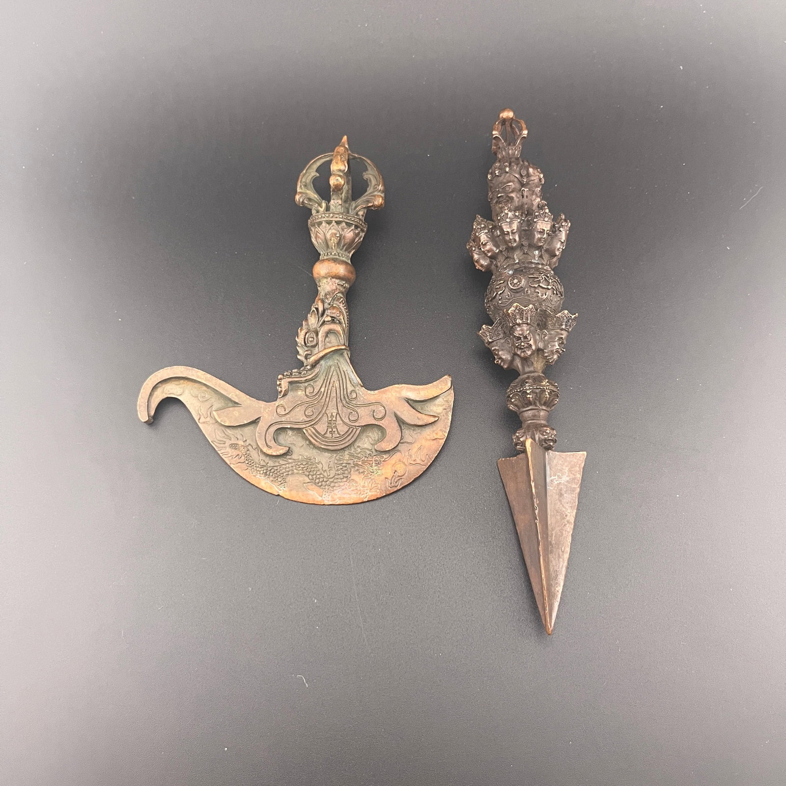 TIBETAN BRONZE KARTIKA AND MULTI-FACED PHURBA DAGGER: Qing Dynasty; Long: 6.8 inch; Width: 1.3 inch; Long: 4.9 inch; Width: 3.88 inch; High: 1.14 inch; ;Wooden base for picture and display only.