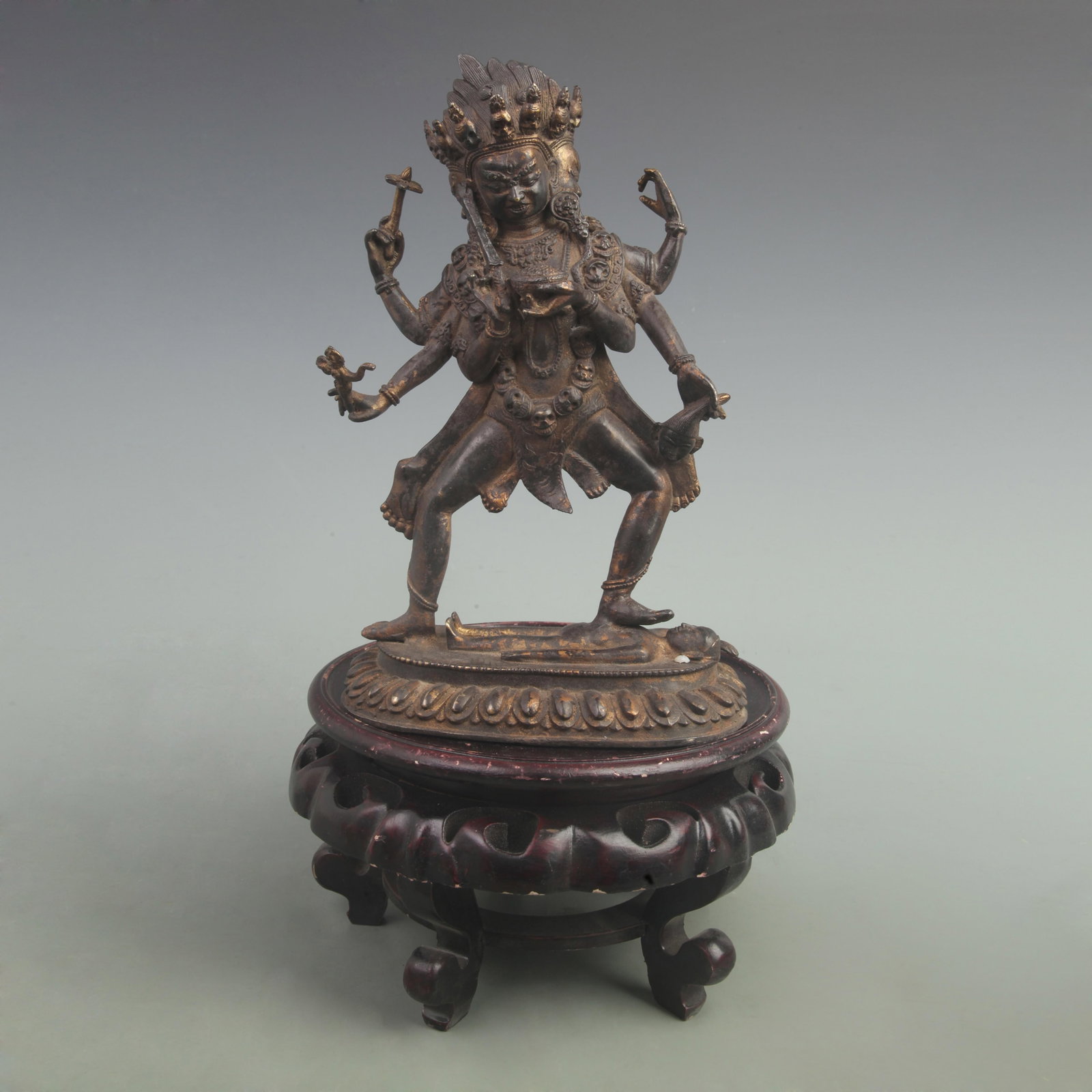 RARE TIBETAN BUDDHISM BRONZE STATUE DEPICTING THE DEITY MAHAKALA: Qing Dynasty; High: 11 inch; Width: 7 inch; ;Wooden base for picture and display only.