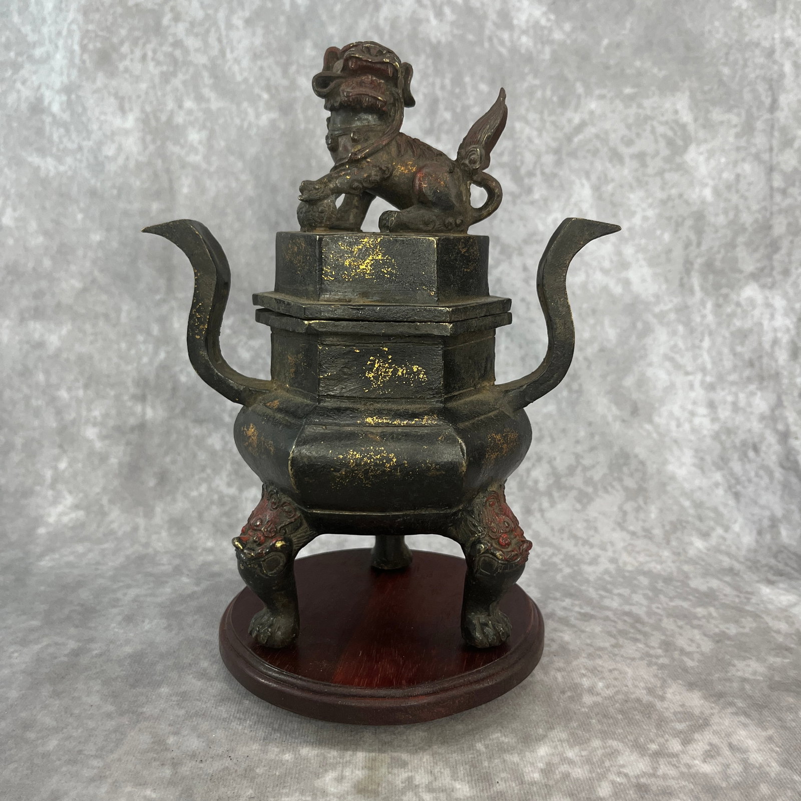 GILT-BRONZE TRIPOD INCENSE BURNER WITH GUARDIAN LION LID: 19th Century; Long: 6.9 inch; Width: 4.6 inch; High: 8.7 inch;;Wooden base for picture and display only.