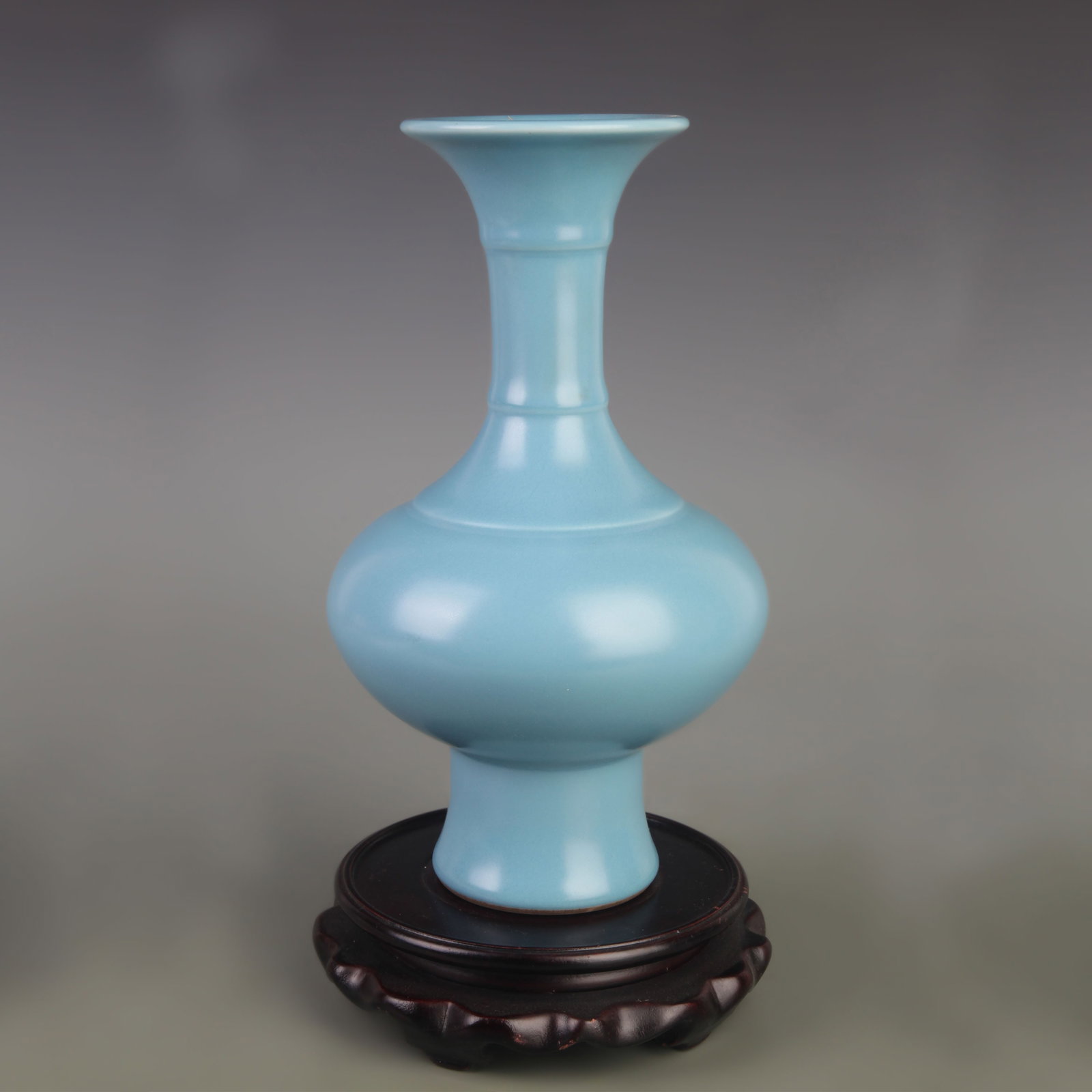 A CLAIRE-DE-LUNE GLAZED PORCELAIN BOTTLE PORCELAIN VASE: Qing Dynasty Yong Zheng Period; Diameter: 5.5 inch; High: 9.4 inch ;Wooden base for picture and display only.
