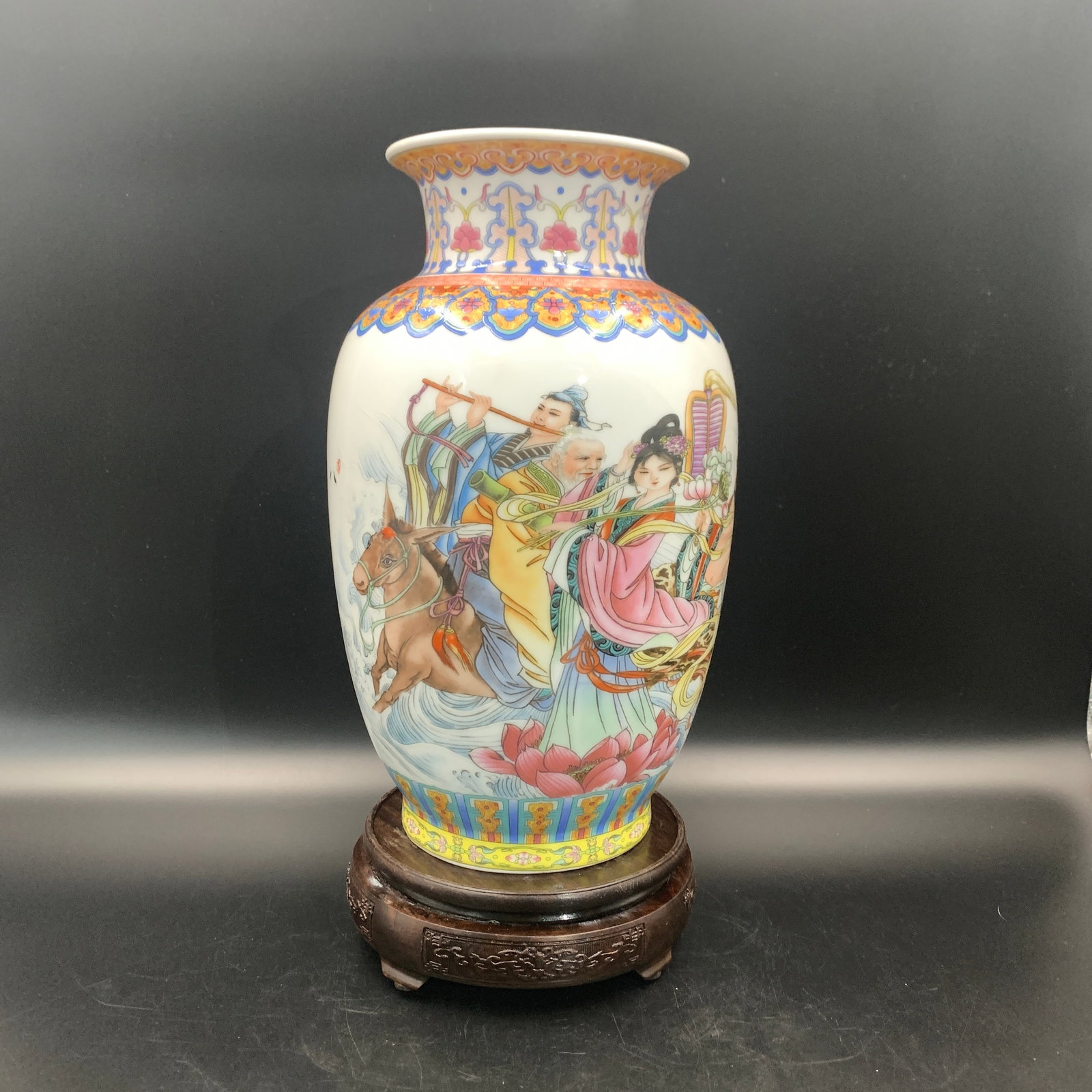FAMILLE ROSE EIGHT IMMORTALS BALUSTER PORCELAIN VASE: Qing Dynasty; High: 12.4 inch; Diameter: 7.3 inch; ;Wooden base for picture and display only.