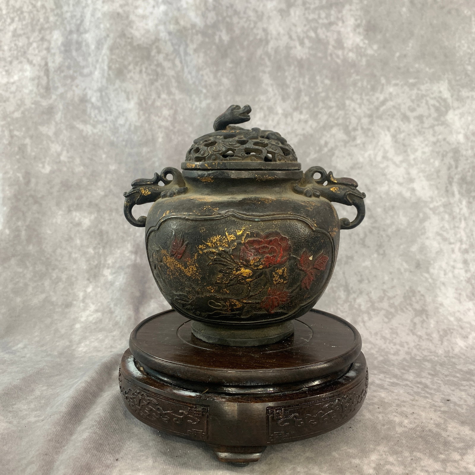 A FINE GILT BRONZE PEONY TRIPOD INCENSE BURNER: Qing Dynasty; Long: 6.5 inch; Width: 5 inch; High: 6 inch; ;Wooden base for picture and display only.