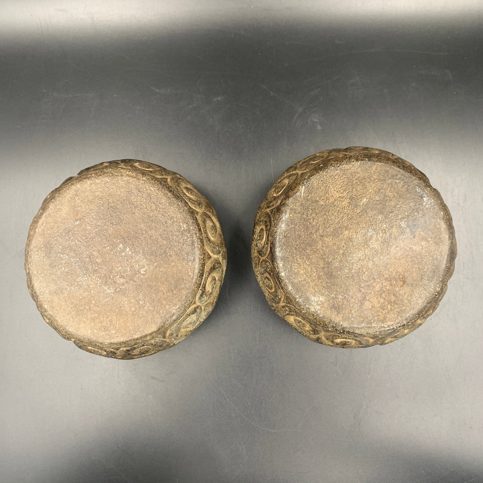 PAIR OF CARVED STONE CLOUD-SCROLL PATTERN BASES - 6
