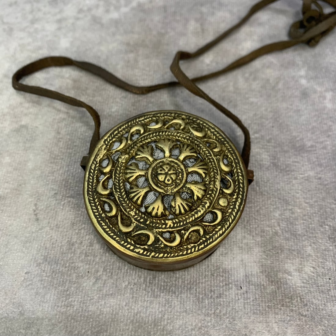 A FINE TIBETAN BUDDHIST GAWU PENDANT: Modern; Diameter: 2.3 inch ;Wooden base for picture and display only.