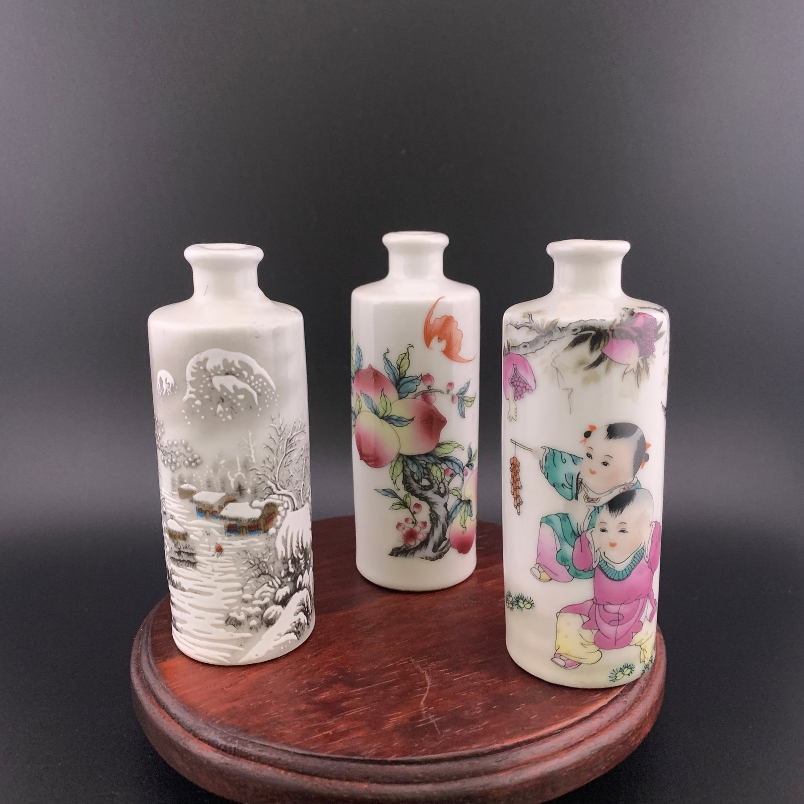 GROUP OF THREE FAMILLE ROSE PORCELAIN SNUFF BOTTLE: Modern; High: 3.74 inch; Diameter: 1.38 inch; High: 3.7 inch; Diameter: 1.35 inch; High: 3.7 inch; Diameter: 1.38 inch; ;Wooden base for picture and display only.