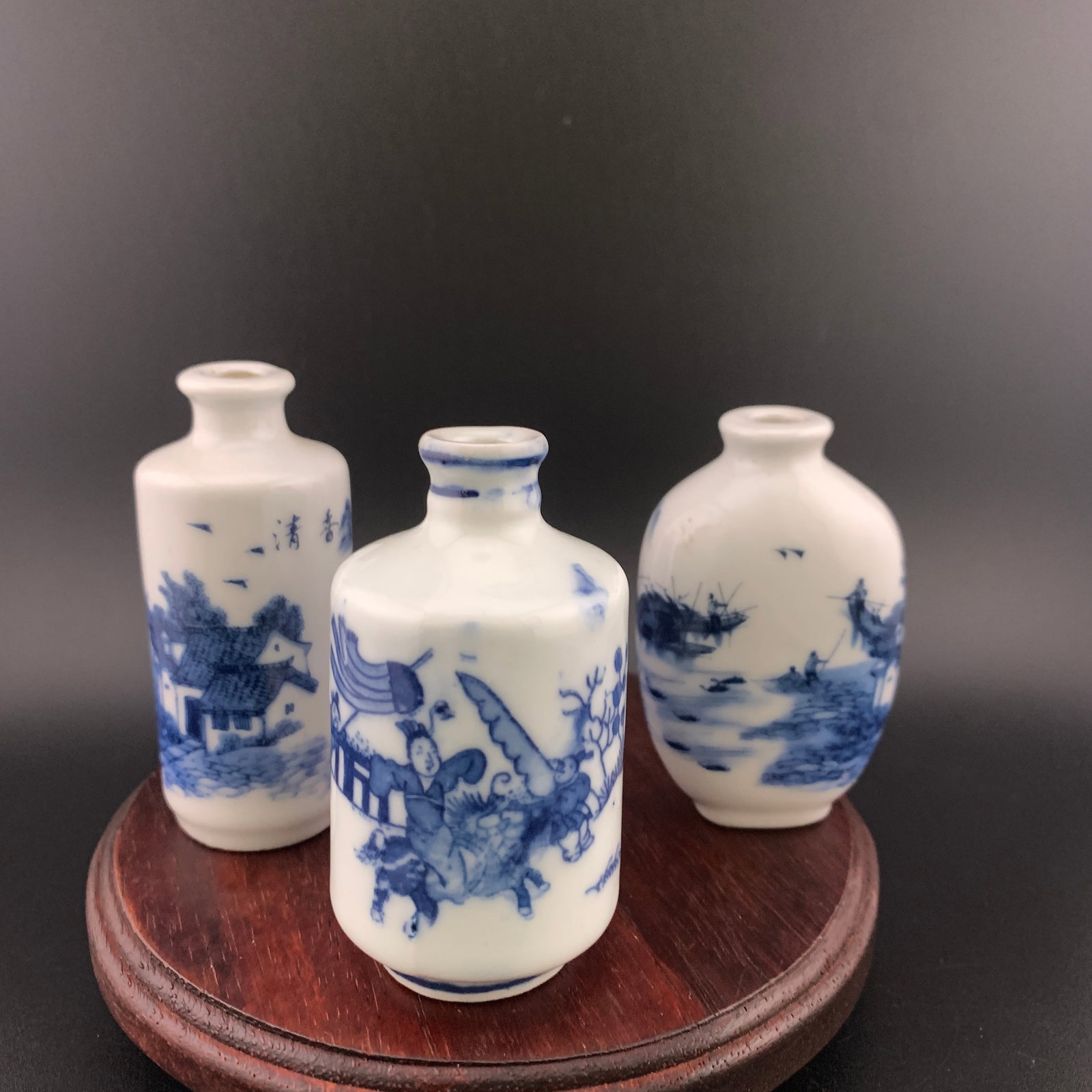 GROUP OF THREE BLUE AND WHITE PORCELAIN SNUFF BOTTLE: Modern; High: 2.9 inch; Diameter: 1.53 inch; High: 3 inch; Diameter: 1.24 inch; Long: 1.7 inch; Width: 1.05 inch; High: 2.73 inch; ;Wooden base for picture and display only.