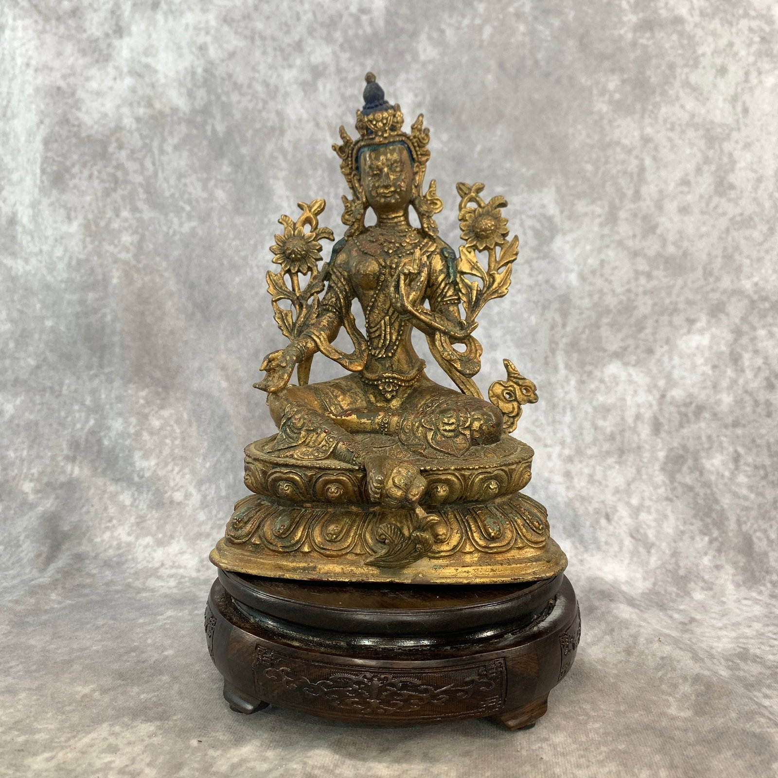 TIBETAN GILT-BRONZE FIGURE OF GREEN TARA SEATED ON A DOUBLE-LOTUS BASE: Ming Dynasty Style; Long: 6.1 inch; Width: 4.9 inch; High: 8.8 inch; ;Wooden base for picture and display only.