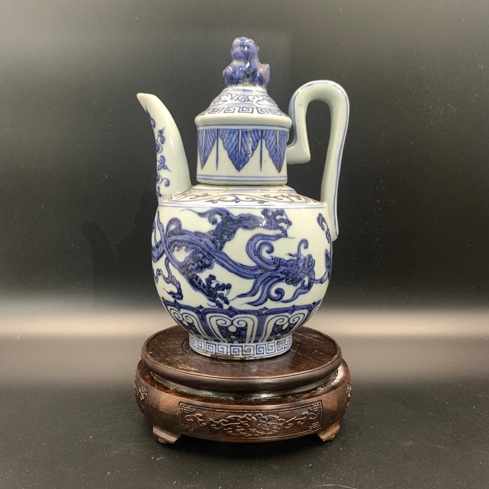 BLUE AND WHITE PORCELAIN 'DRAGON' EWER AND COVER: Ming Dynasty Style; Long: 6.2 inch; Width: 5.4 inch; High: 9.1 inch; ;Wooden base for picture and display only.