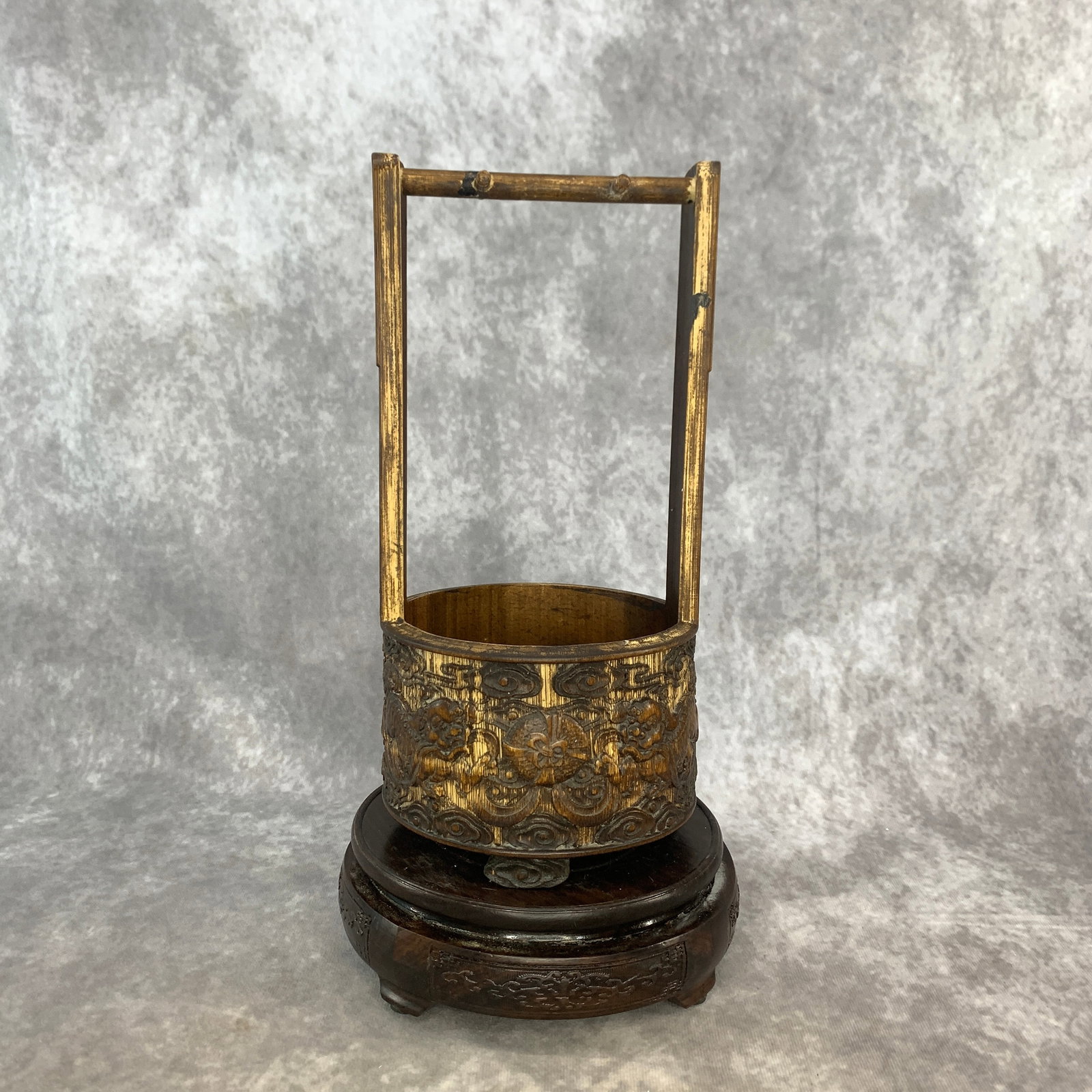 CARVED BAMBOO-IMITATION BUCKET VESSEL WITH OVERHEAD HANDLE: Republic Period; High: 10.5 inch; Diameter: 5.1 inch; ;Wooden base for picture and display only.