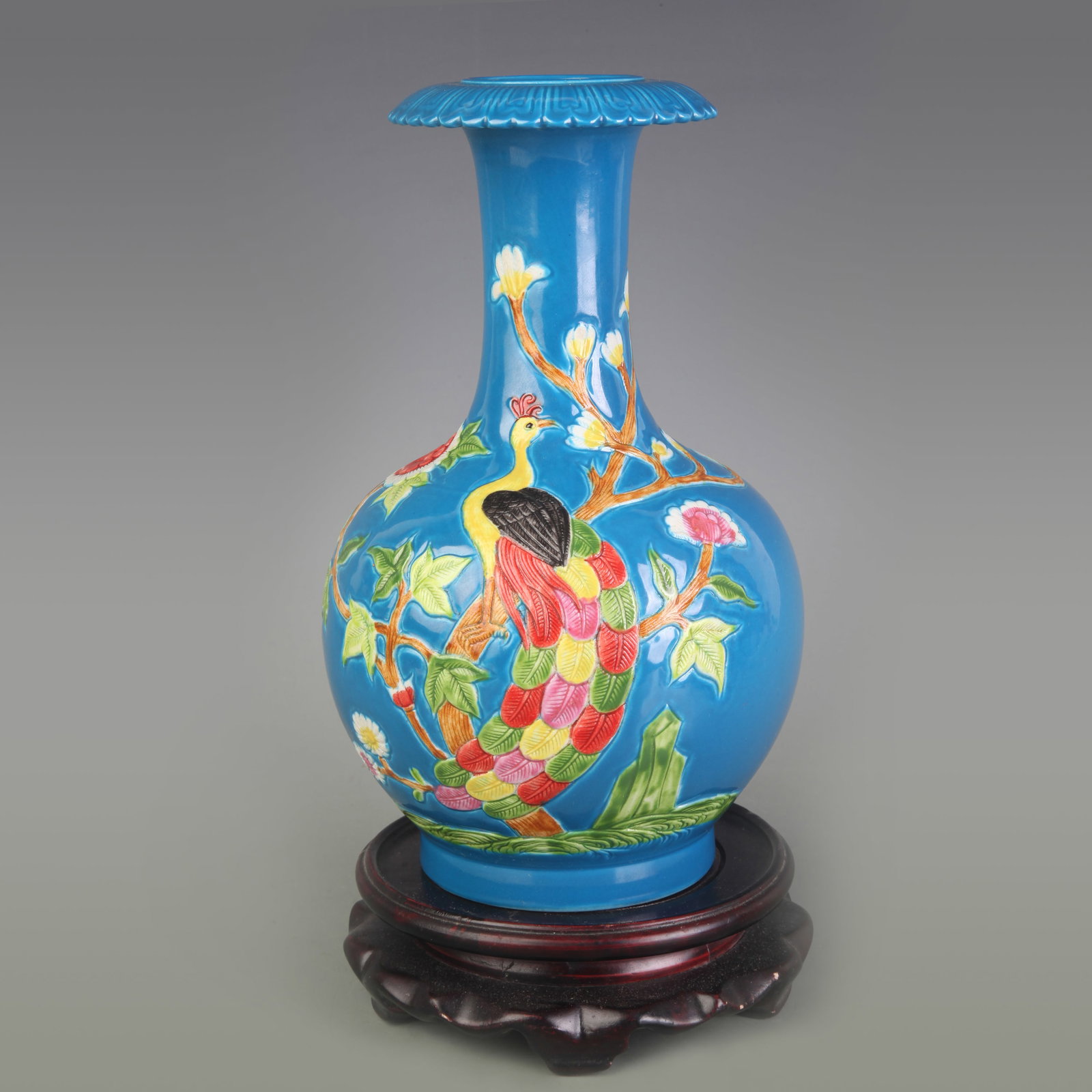 BLUE GLAZE CARVED FLORAL BIRD PATTERN PORCELAIN VASE: Qing Dynasty Qian Long Period: Diameter: 3.1 inch; High: 8.5 inch ;Wooden base for picture and display only.