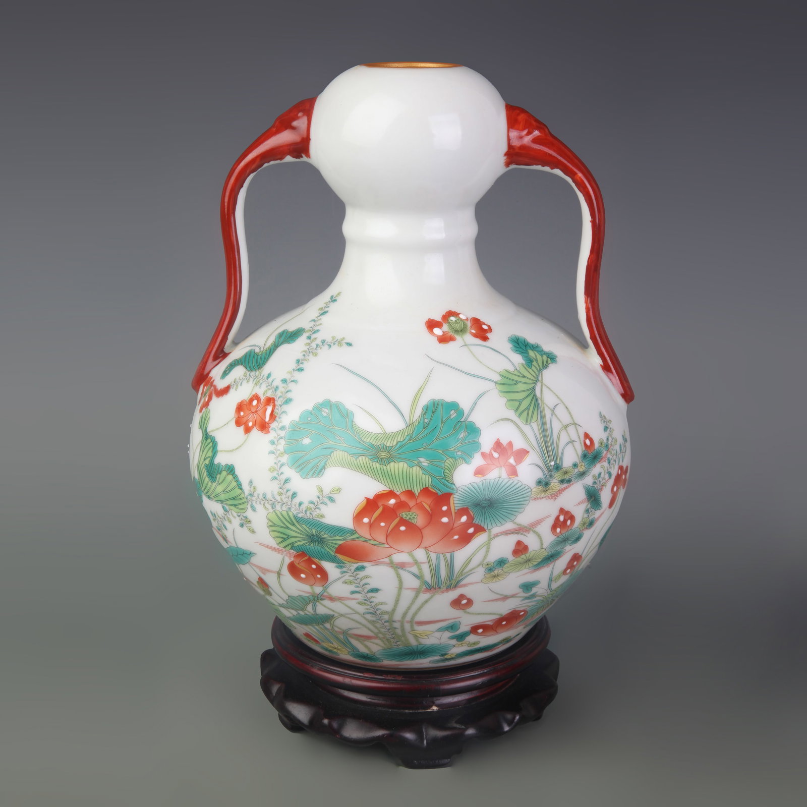 A FAMILLE ROSE GARLIC-HEAD VASE WITH LOTUS AND RUYI MOTIF: Qing Dynasty Qian Long Period; High: 9.4 inch; Diameter: 1.4 inch ;Wooden base for picture and display only.