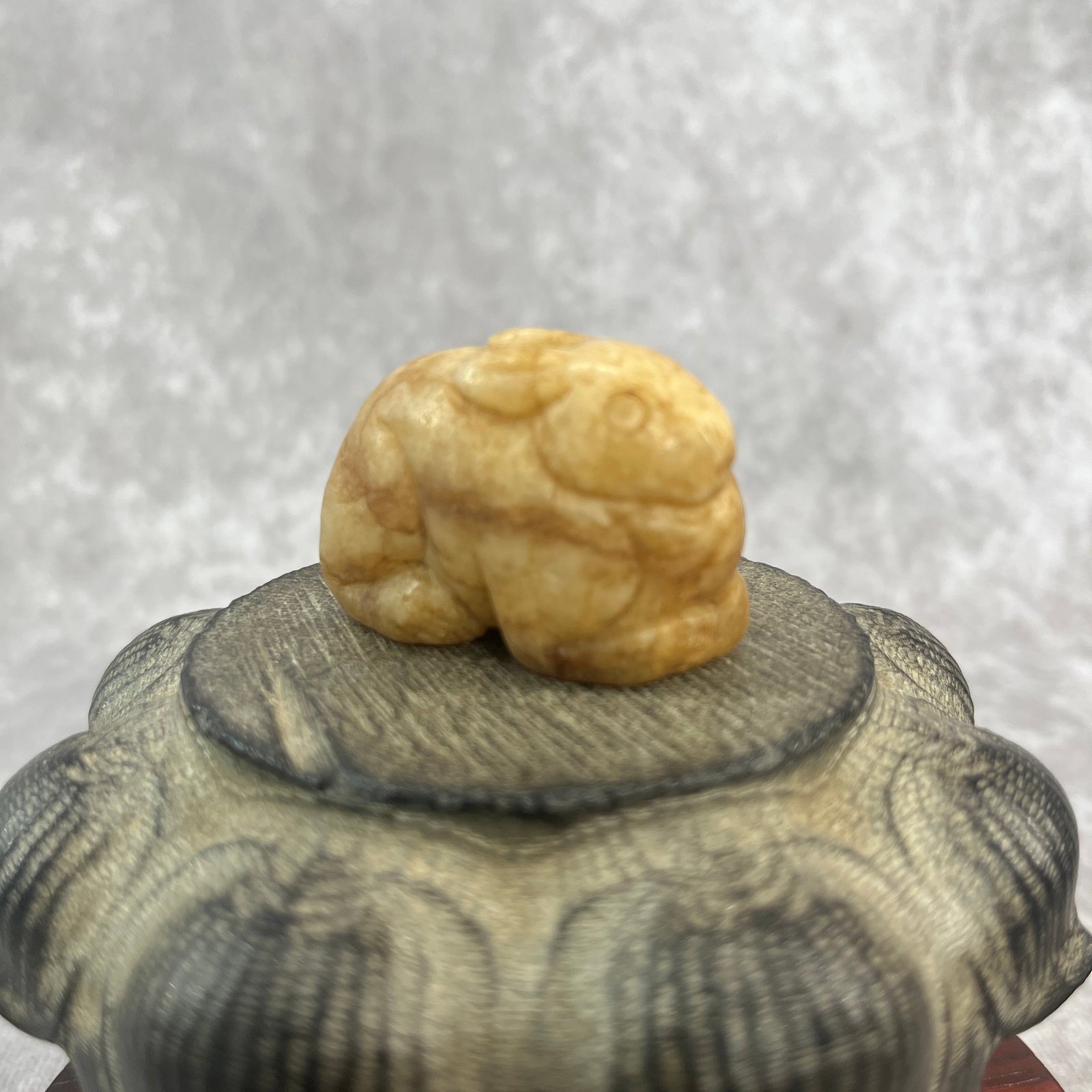 CARVED JADE FIGURINE OF A CROUCHING RABBIT: Qing Dynasty; Long: 1.89 inch; Width: 1.3 inch; High: 1.02 inch; ;Wooden base for picture and display only.