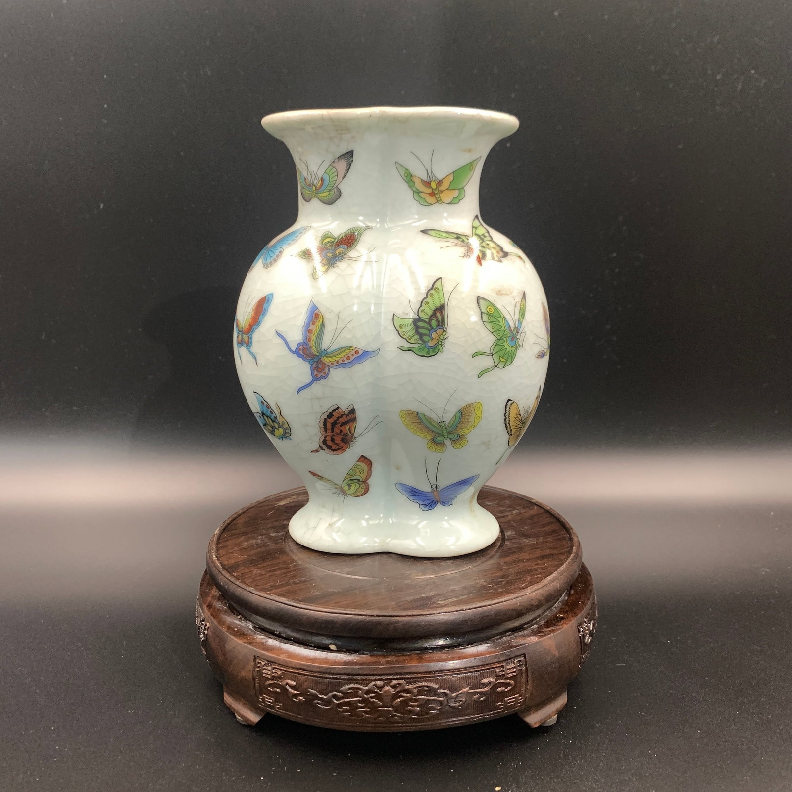 A FAMILLE-ROSE 'HUNDRED BUTTERFLIES' LOBED PORCELAIN VASE: Republic Period; Long: 5 inch; Width: 3.3 inch; High: 6.7 inch; ;Wooden base for picture and display only.