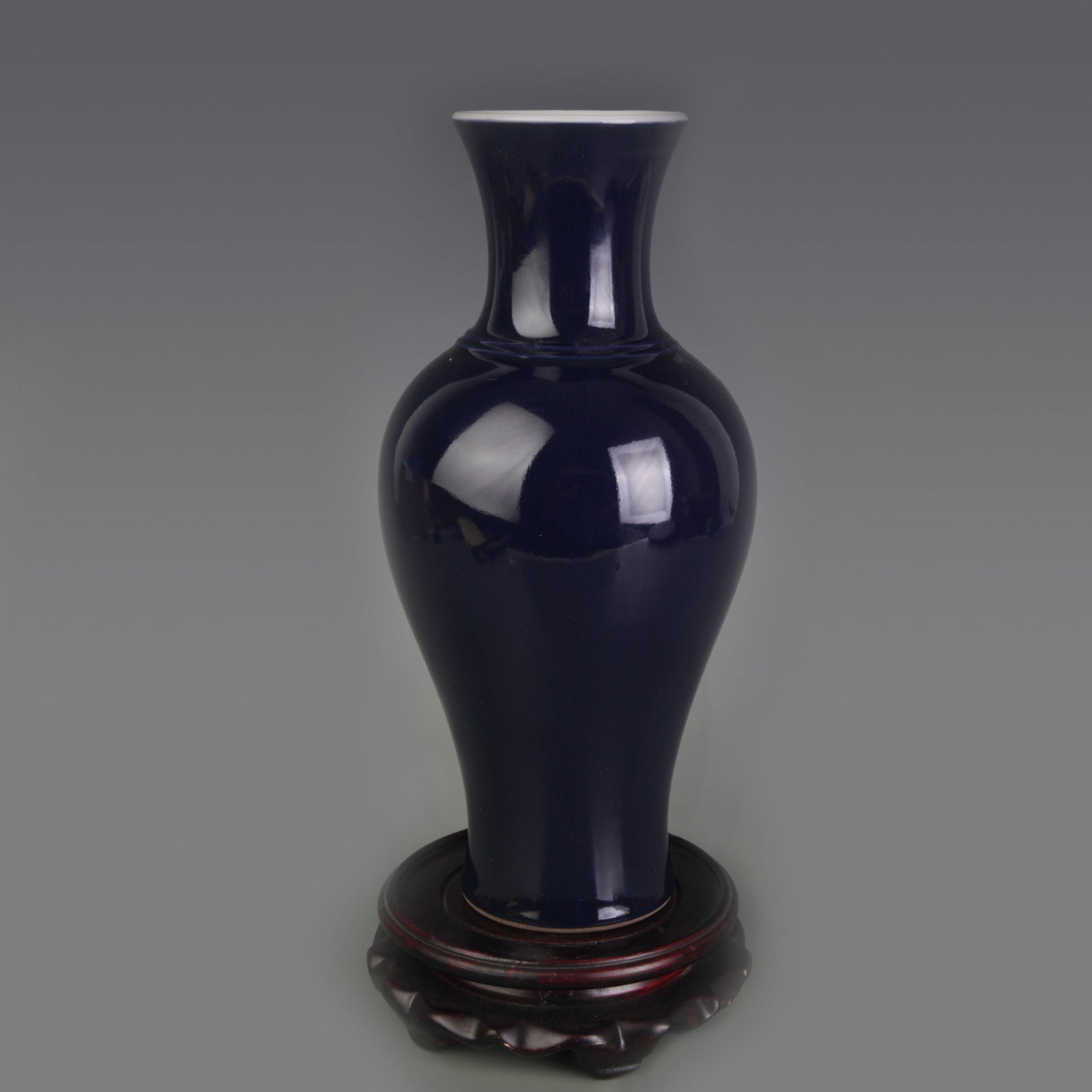 A FINE SACRIFICIAL BLUE-GLAZED PORCELAIN VASE: Qing Dynasty Qian Long Period; Diameter: 2.9 inch; High: 10.3 inch ;Wooden base for picture and display only.