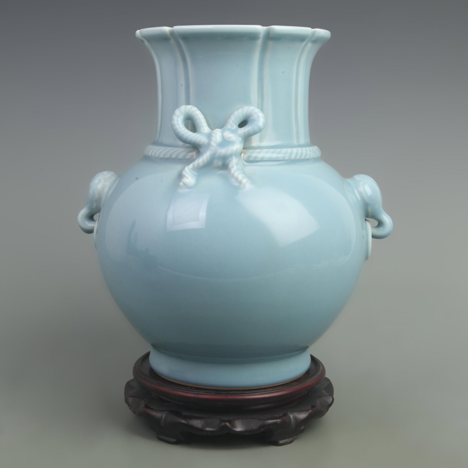 POWDER BLUE GLAZED VASE WITH BUTTERFLY KNOTS, ELEPHANT TRUNK HANDLES: Qing Dynasty Qian Long Period; High: 10.8 inch; Width: 12 inch; ;Wooden base for picture and display only.