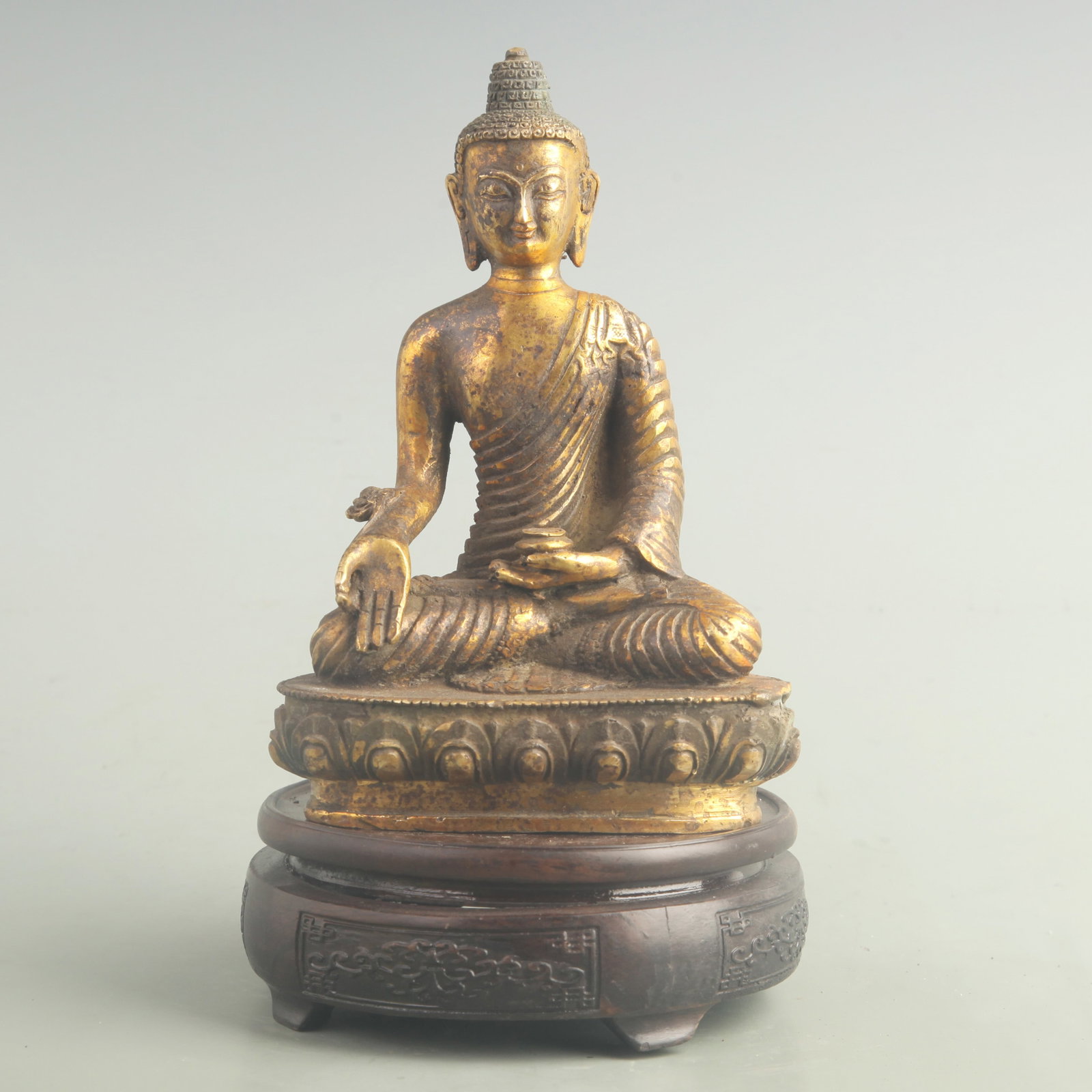 A FINE BRONZE GILT FIGURE OF SHAKYAMUNI BUDDHA: 19th Century; High: 7.20 inch; Width: 5.00 inch ;Wooden base for picture and display only.