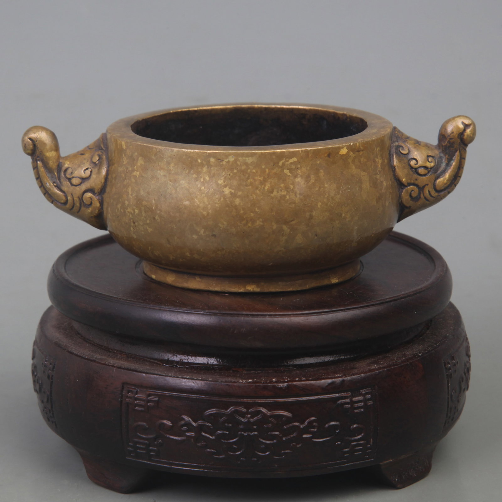 A FINE BRONZE GILDED ELEPHANT EAR CENSER: Qing Dynasty; Diameter: 4.8 inch; High: 1.5 inch; ;Wooden base for picture and display only.