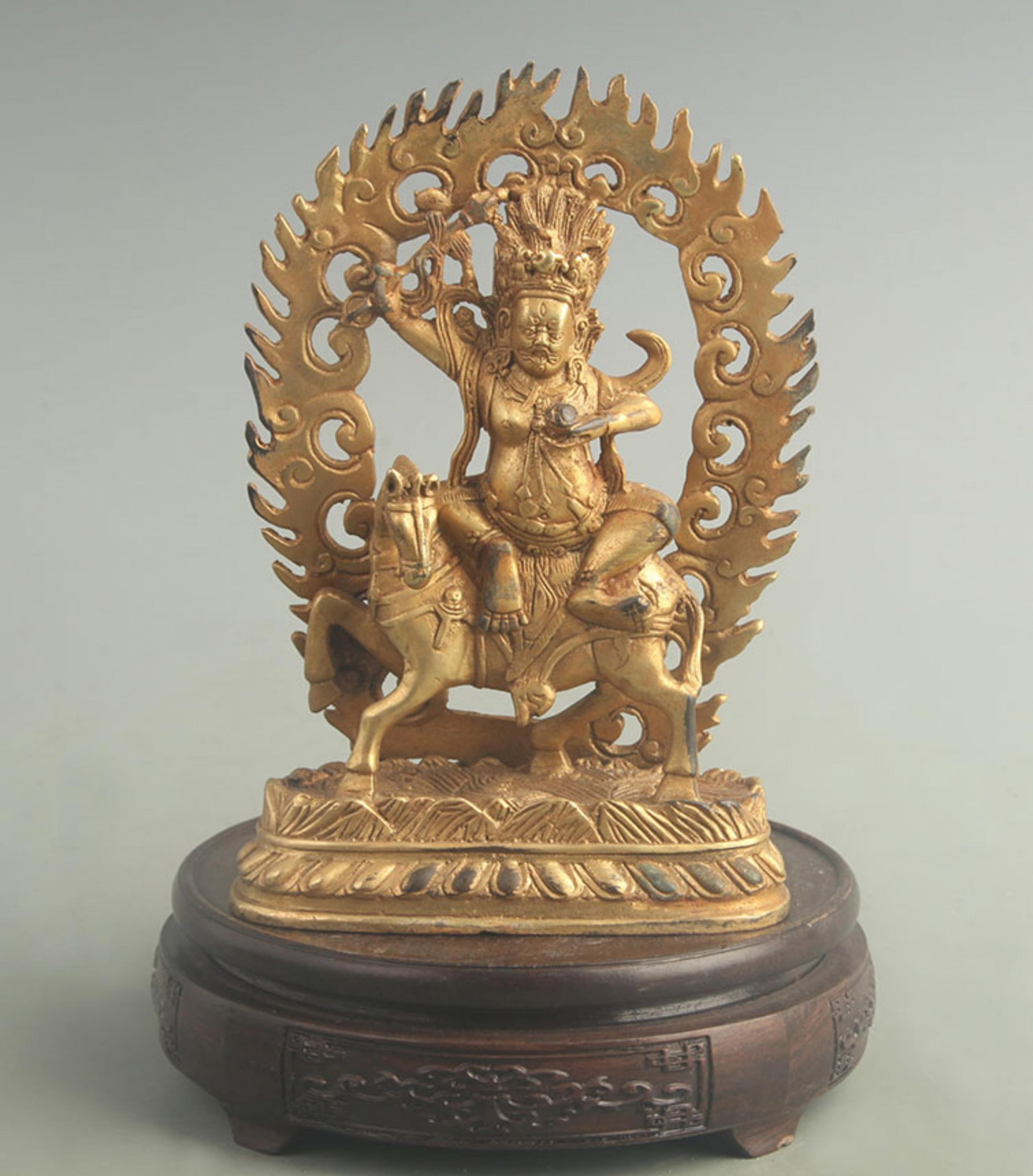 A GILT-BRONZE FIGURE OF A TIBETAN BUDDHIST DHARMAPALA: 19th Century; High: 7.00 inch; Width: 2.00 inch; Long: 5.00 inch ;Wooden base for picture and display only.