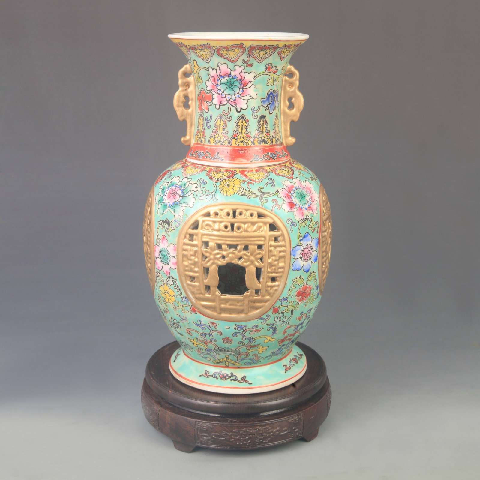 FAMILLE ROSE INNER REVOLVING PORCELAIN VASE: Qing Dynasty Qian Long Period; High: 11.6 inch; Diameter: 7.00 inch; ;Wooden base for picture and display only.