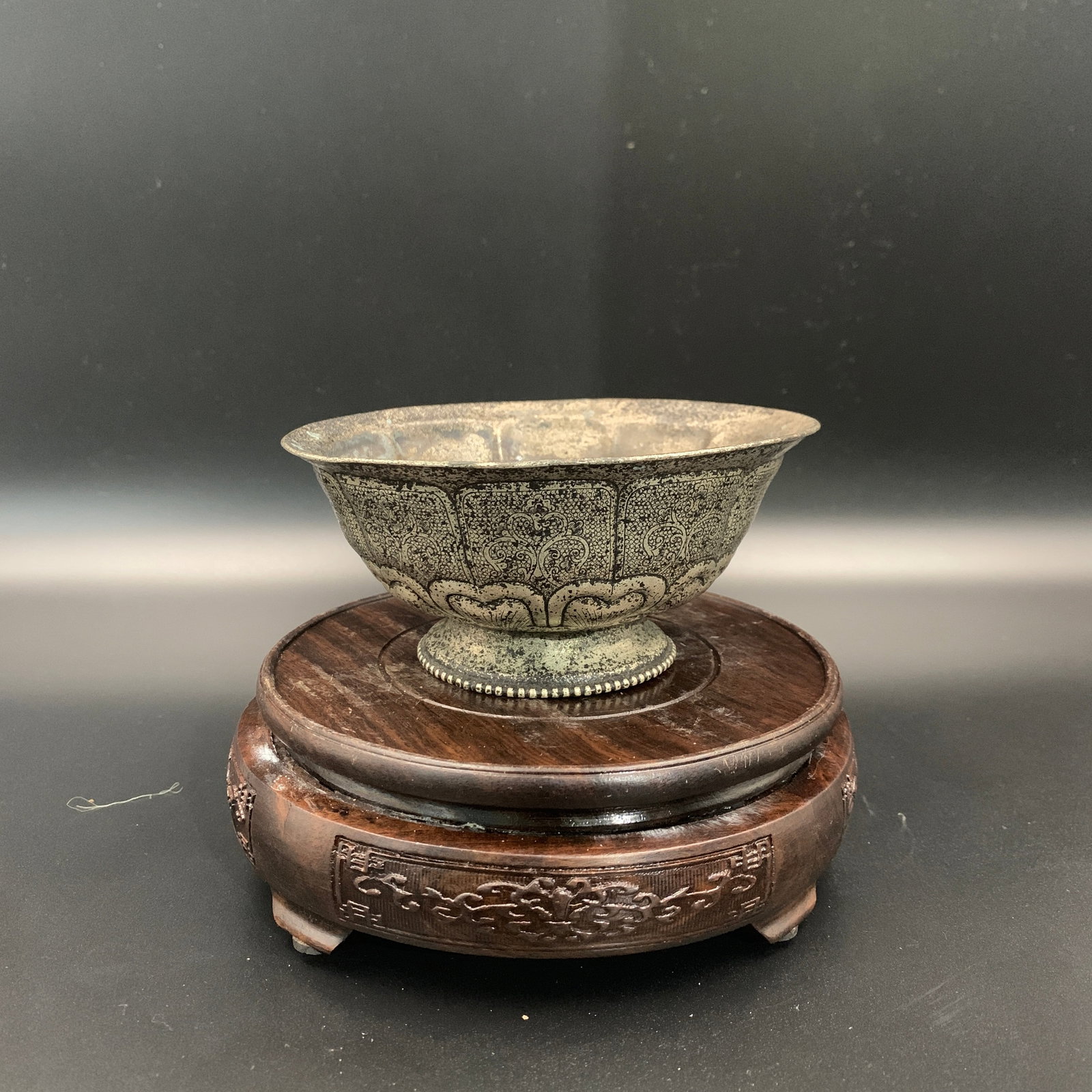 AN ENGRAVED SILVERED BRONZE FLARED FOOTED BOWL: Qing Dynasty; High: 2.5 inch; Diameter: 5.4 inch; ;Wooden base for picture and display only.