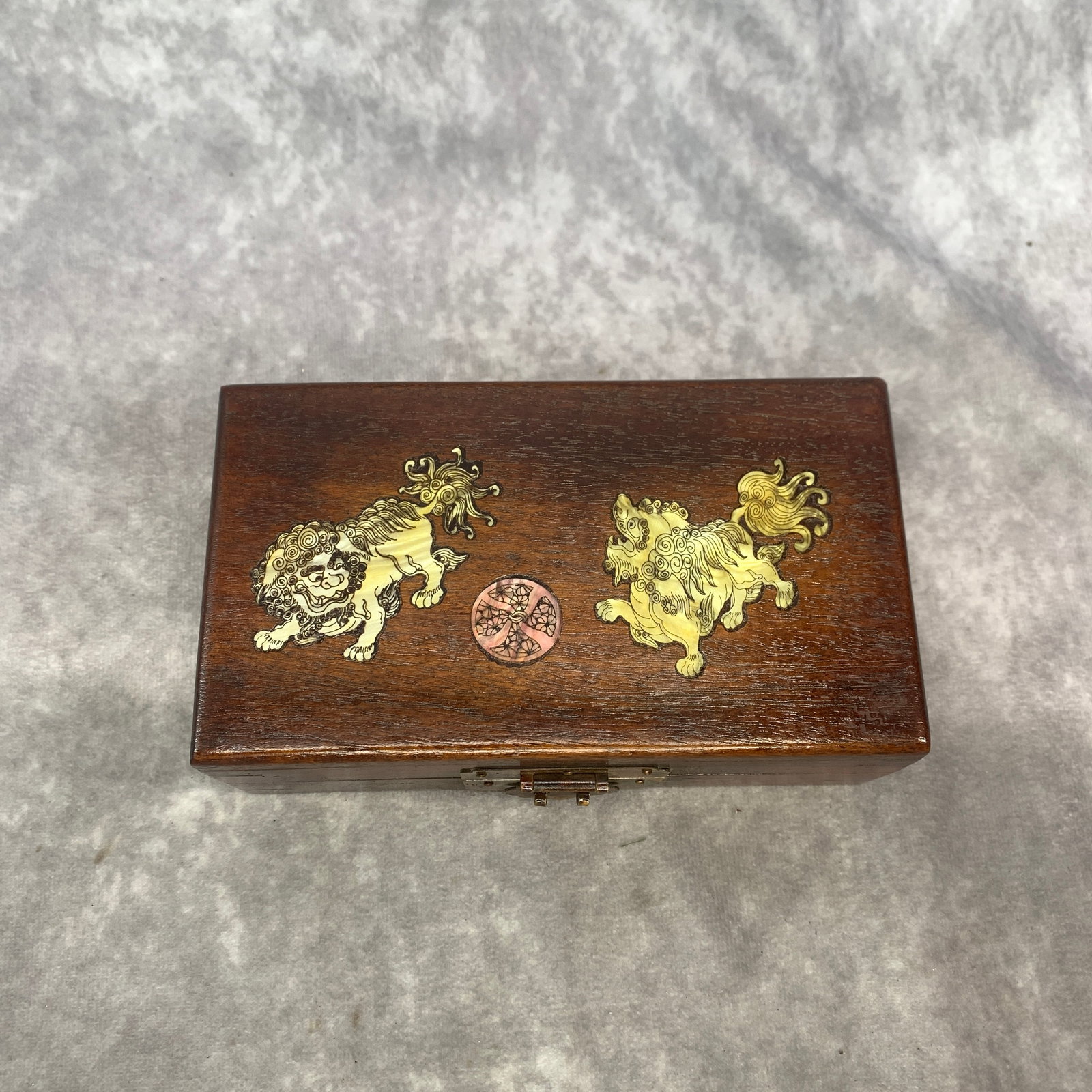 HARDWOOD BOX WITH MOTHER-OF-PEARL BUDDHIST LIONS: Republic Period; Long: 6.27 inch; Width: 3.75 inch; High: 2.3 inch; . Wooden base for display only