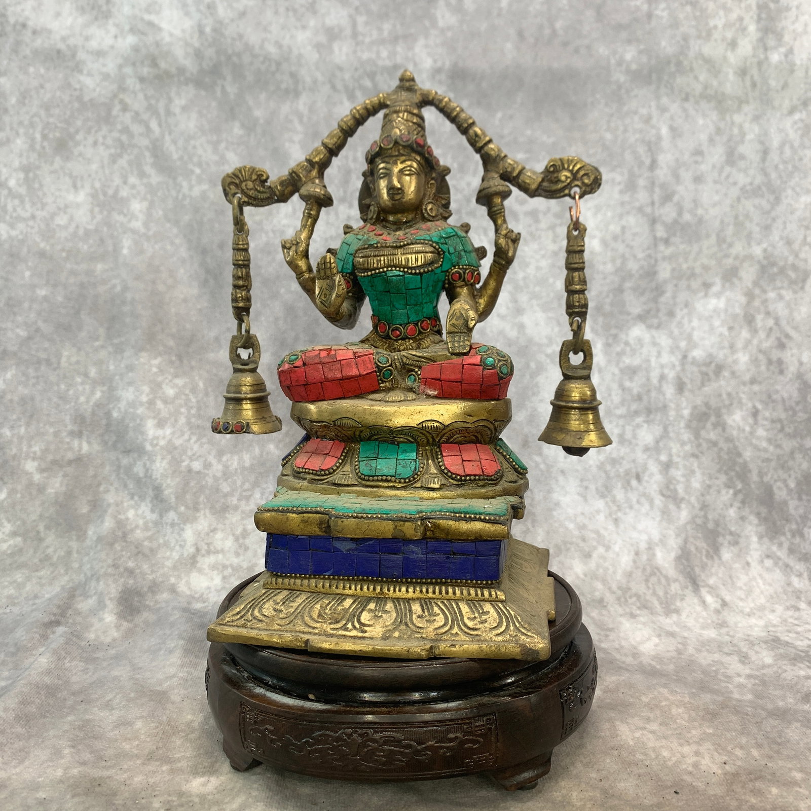 HIMALAYAN BRASS ALTAR STATUE OF LAKSHMI WITH HANGING BELLS: Qing Dynasty; Long: 5.2 inch; Width: 5.4 inch; High: 9.6 inch; . Wooden base for display only