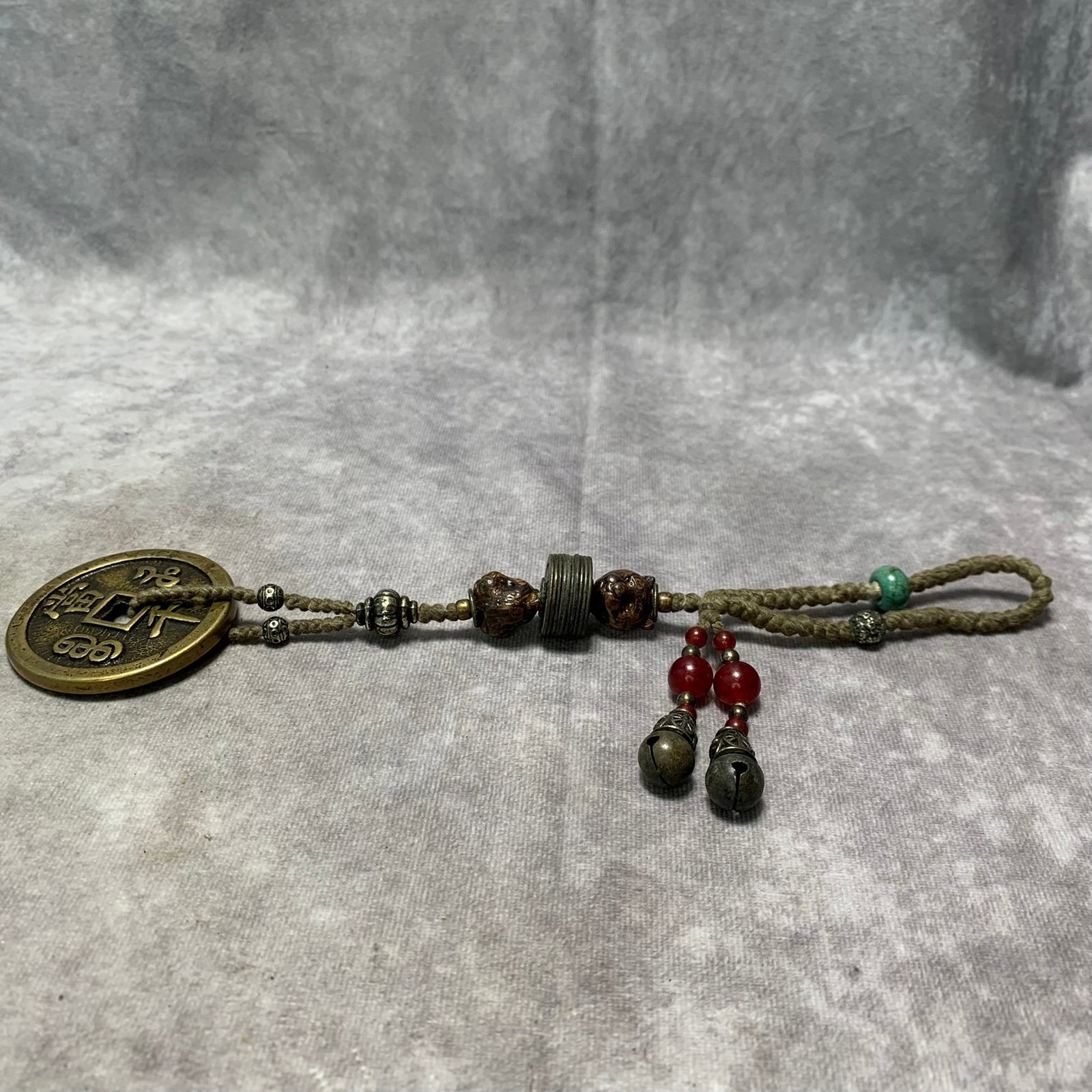 A CRYSTAL, AMBER, AND COIN MADE PENDANT: Qing Dynasty; Long: 11 inch; Width: 2.3 inch; H; 0.9 inch; . Wooden base for display only