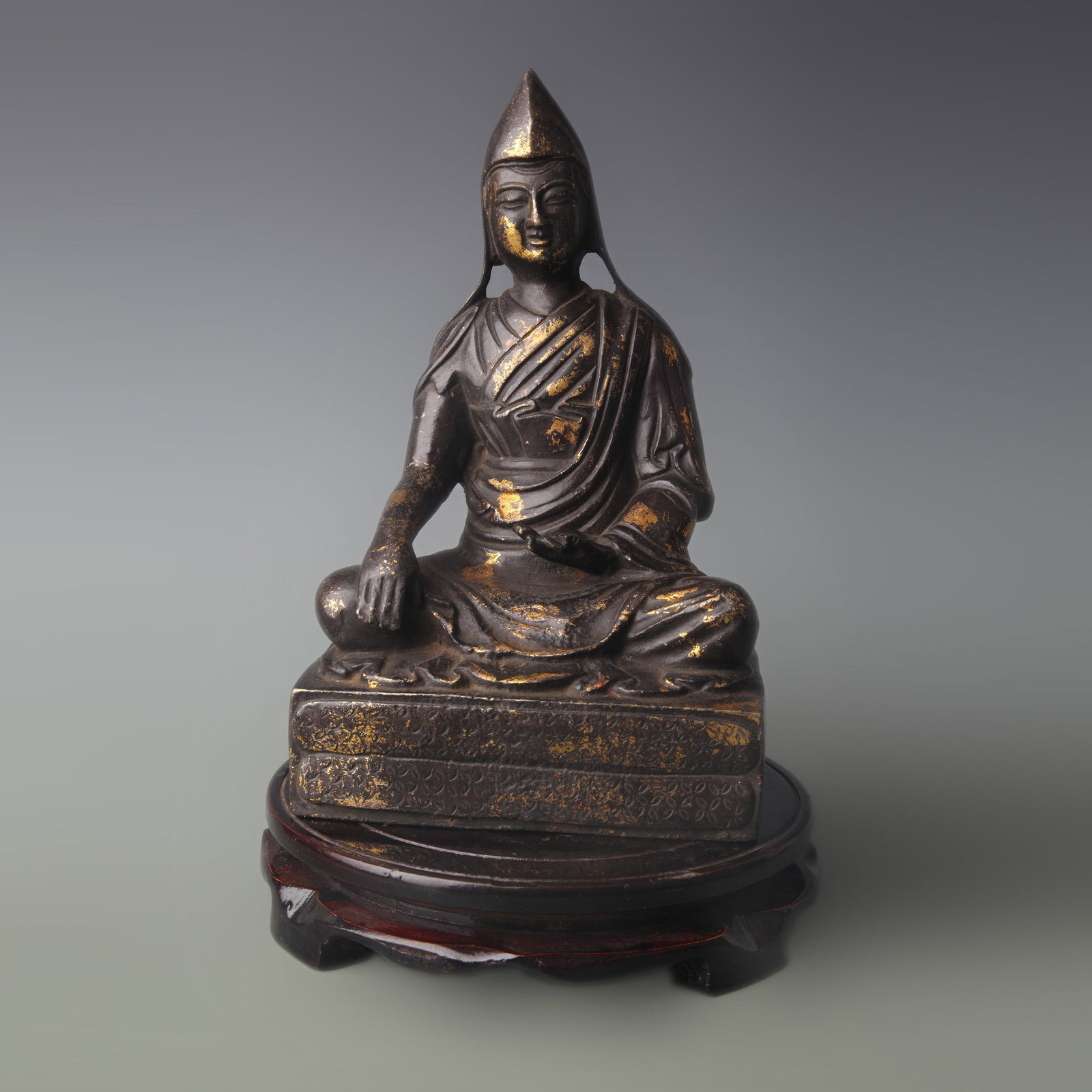 TIBETAN PARTIAL-GILT BRONZE STATUE OF JE TSONGKHAPA: Qing Dynasty; High: 8.9in. Wooden base for display only