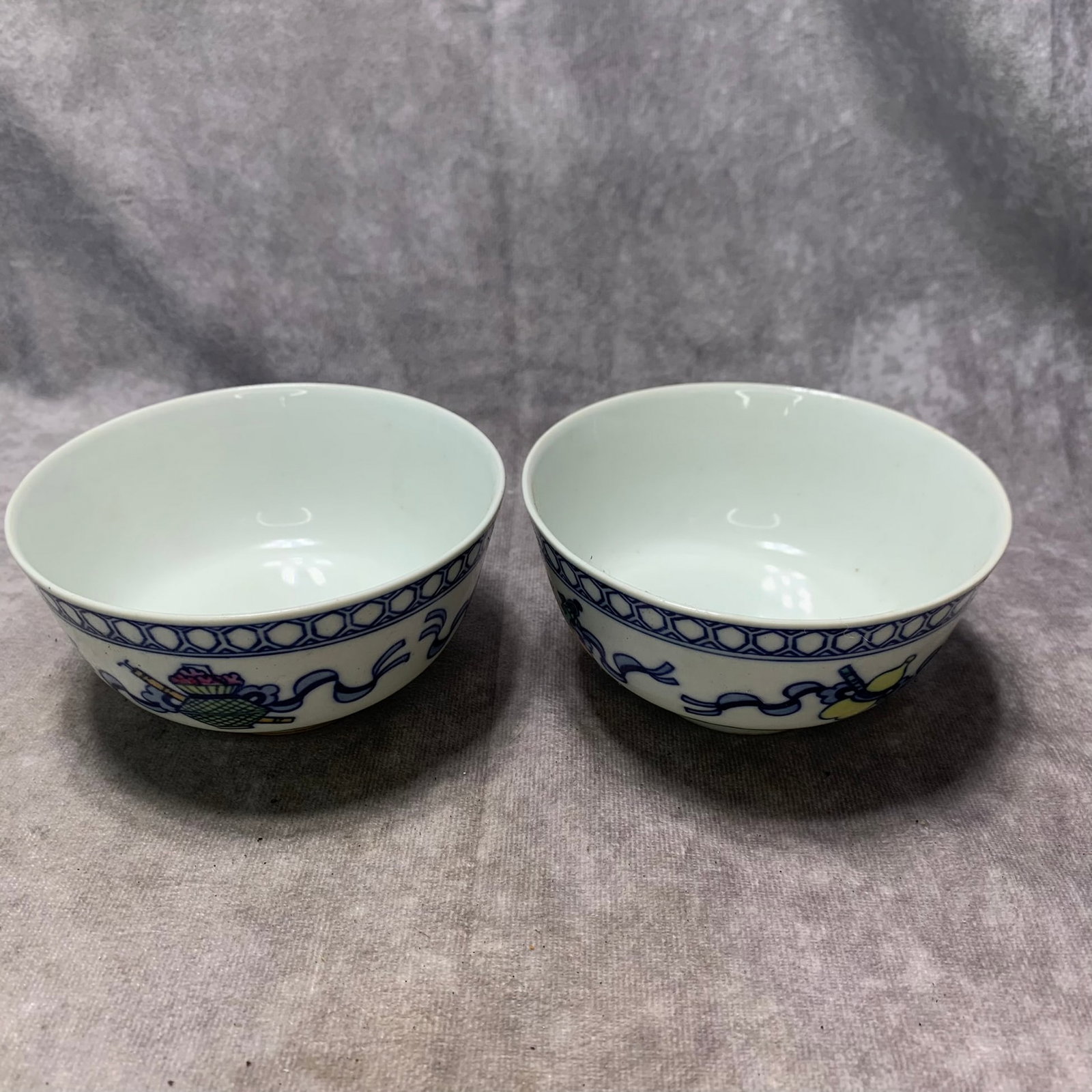 PAIR OF FAMILLE ROSE SMALL BOWLS WITH FORTUNE-AND-LONGEVITY MOTIF,: Qing Dynasty; Long: 5.0 inch; Width: 3.5 inch; High: 5.7 inch; . Wooden base for display only
