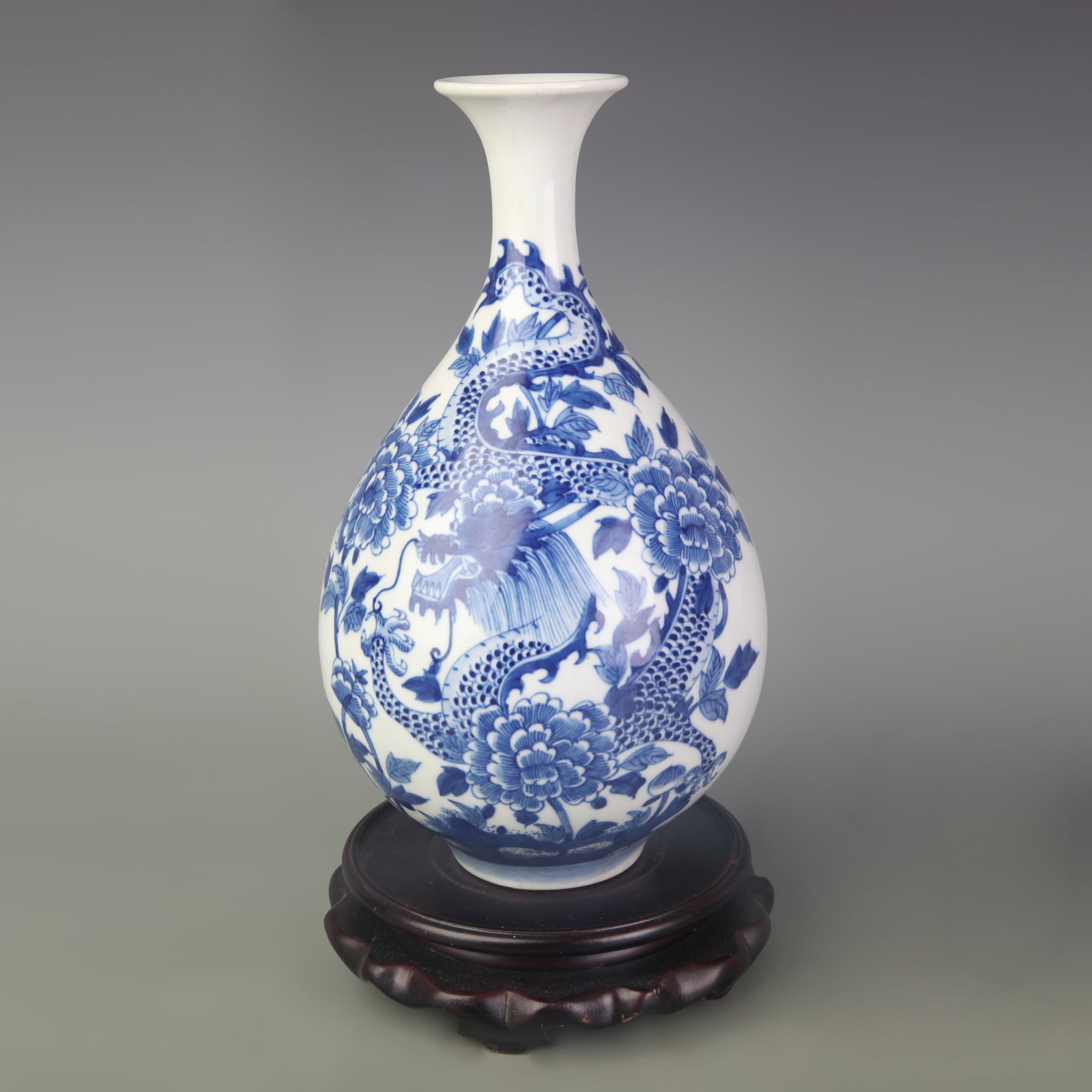 A BLUE AND WHITE DRAGON YUHUCHUN VASE: Qing Dynasty Kang Xi Period; Diameter: 2.2 inch; High: 9.8 inch; . Wooden base for display only