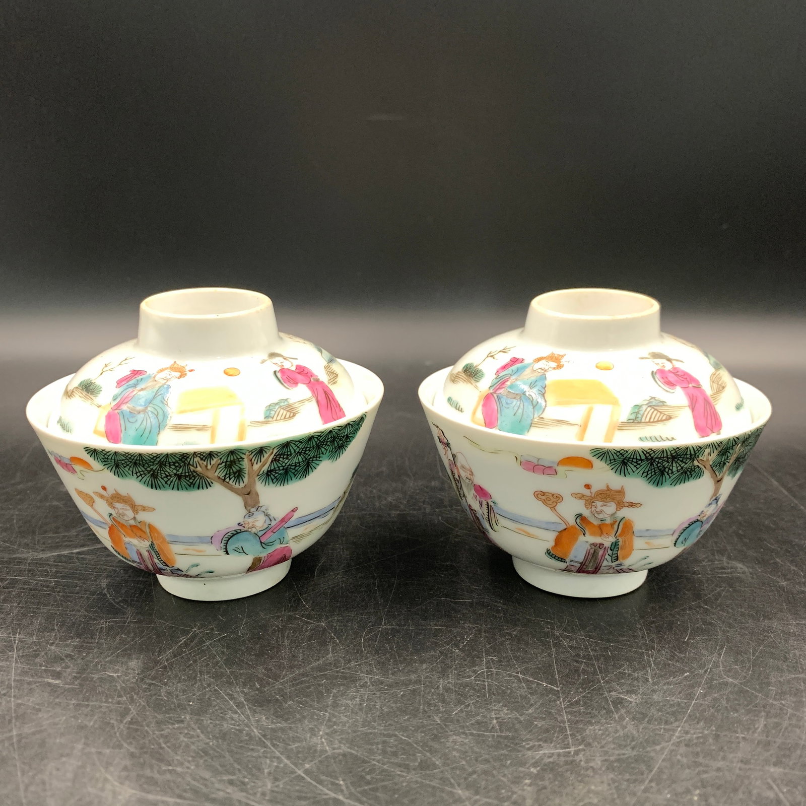 PAIR OF FAMILLE ROSE GAIWAN TEACUPS WITH FIGURES